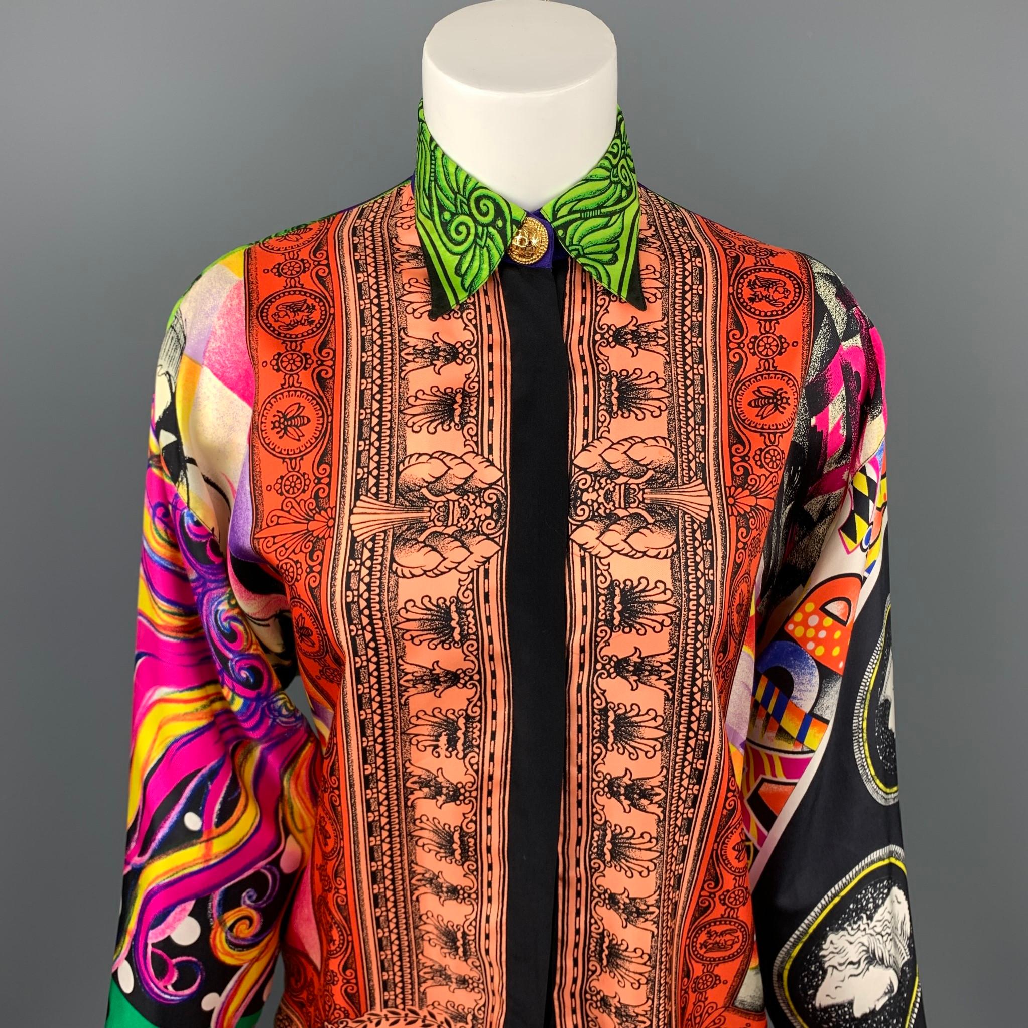 Vintage GIANNI VERSACE blouse comes in a multi-color baroque silk featuring gold button details, spread collar, and a hidden button closure. Minor discoloration. Made in Italy.

Very Good Pre-Owned Condition.
Marked: IT 38

Measurements:

Shoulder: