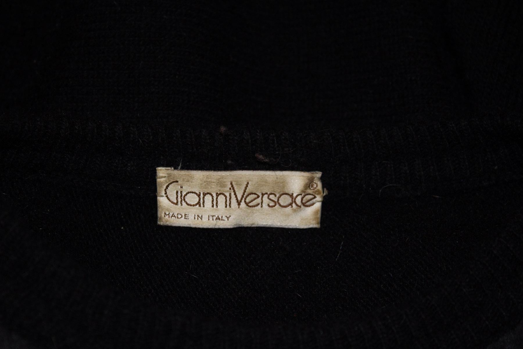 A great vintage jumper by Gianni Versace. In a wool and angora mix the jumper has an attractive satin triangle on the front, covering approximately half the jumper, and it has attractive rib detail at the hem. Size 1
Measurements. Bust up to 41'',