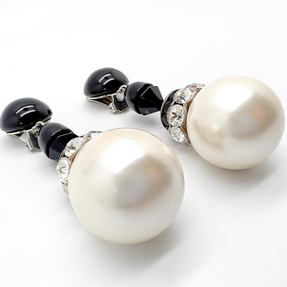 A spectacular pair of Vintage Giant Pearl Monochrome Drop Earrings. Scale and detail abound. Gobstopper size pearls embellished with delightful crystal and black faceted glass in fancy cuts creating an eternally chic item of wearable monochrome art.