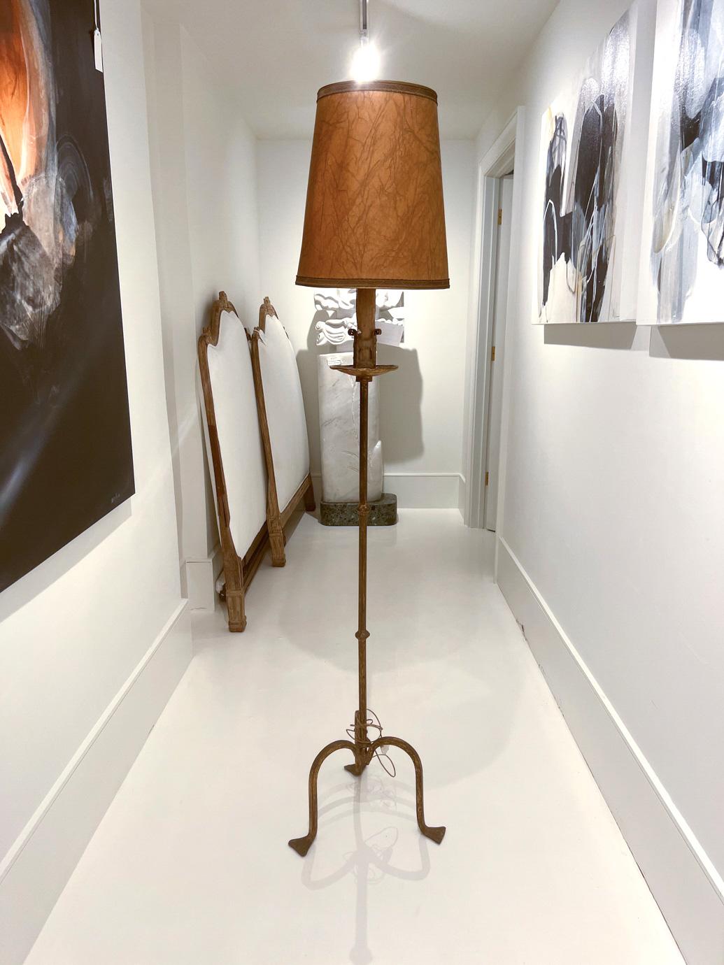 This lamp has endless opportunities in any decor. It will fit in anywhere due to its slender profile and graceful base. The candle at the top is artfully fashioned with real wax drippings. European wiring will need to be upgraded.
