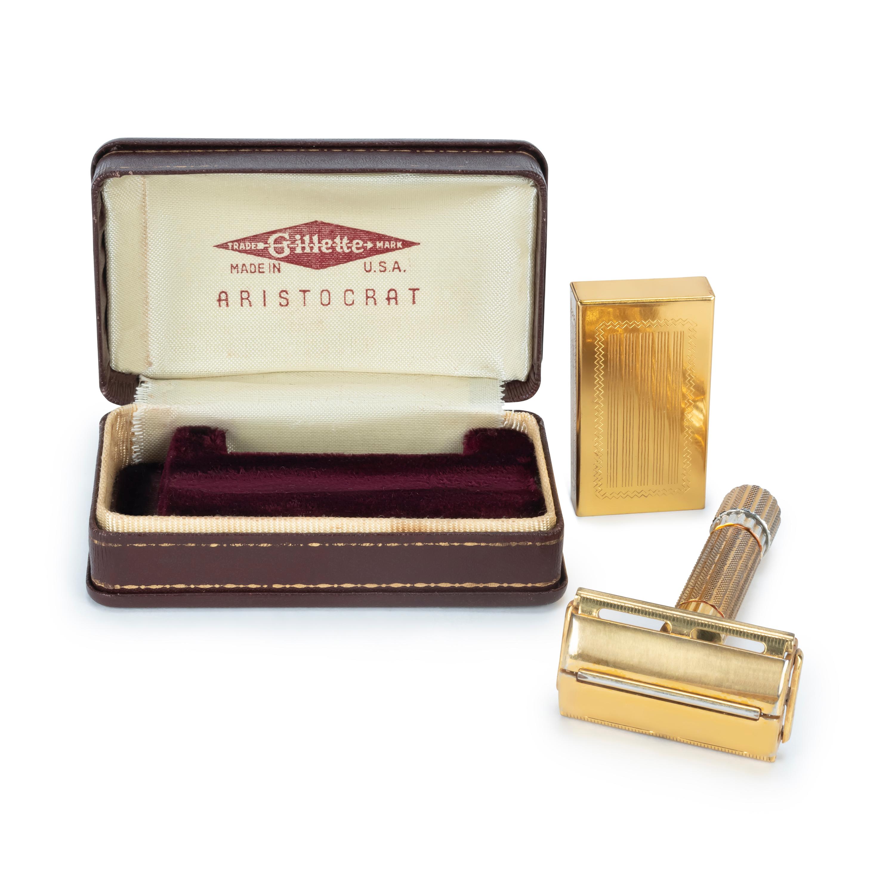 Vintage Gillette Aristocrat Safety Gold plated Razor with Gold plated Case & gold plated Blade Holder. Red luxuries velvet on the inside with cream trimmings and chocolate lather on the outside. They sure don’t make them like this anymore. 
You know