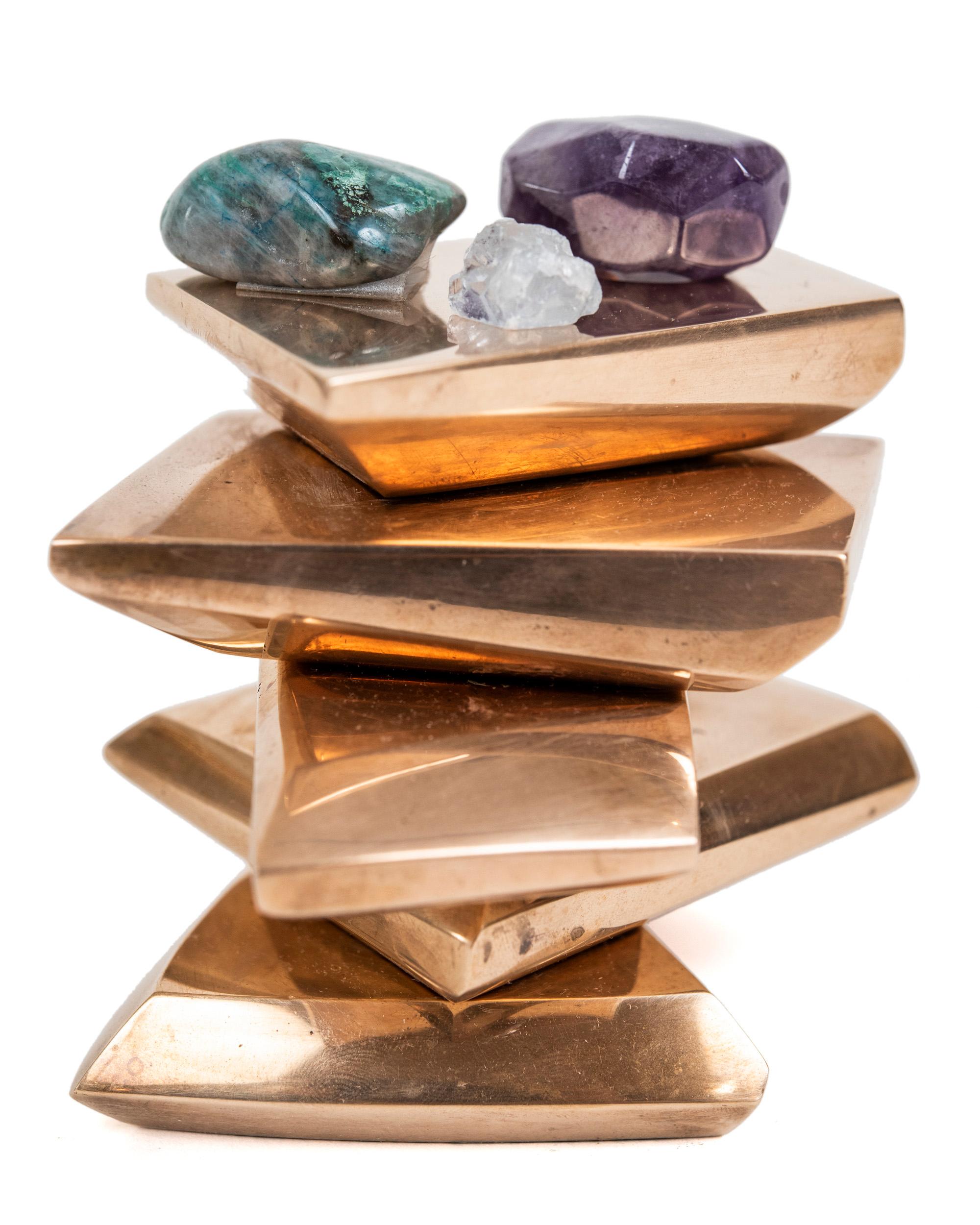 A small yet powerful abstract made of five moveable bronze pieces with the top one having a small 3/4