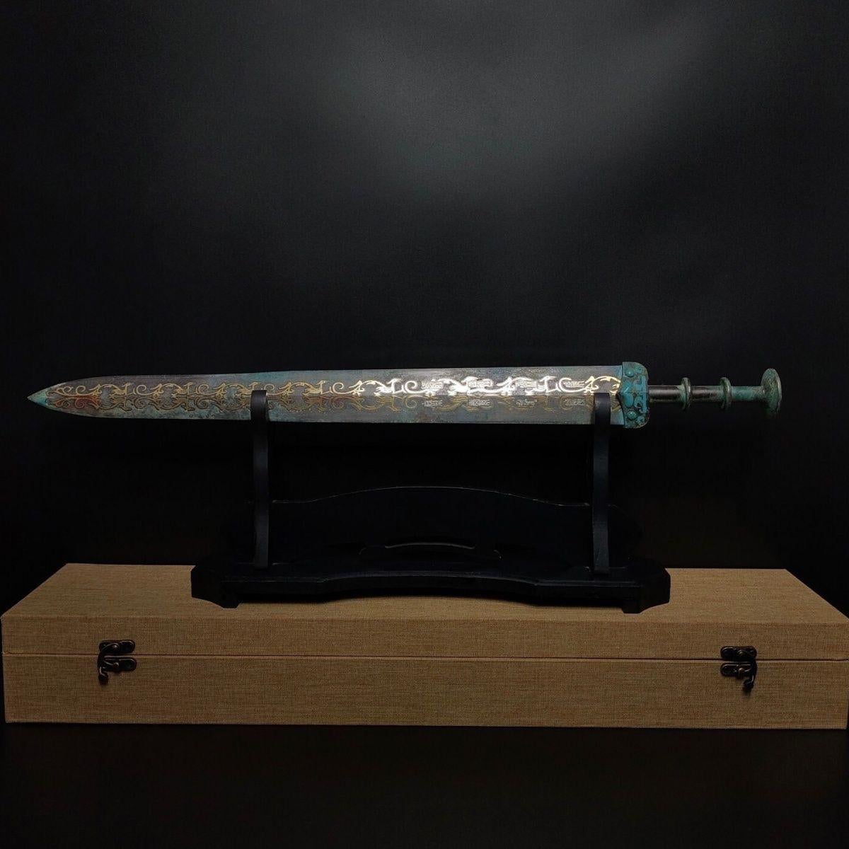 This antique Chinese bronze sword is very well preserved, it has excellent copper quality, fine structure, mellow patina, smooth, and sharp edge. The blade of this sword is longer; the stem can be used by both hands, and the end of the sword is