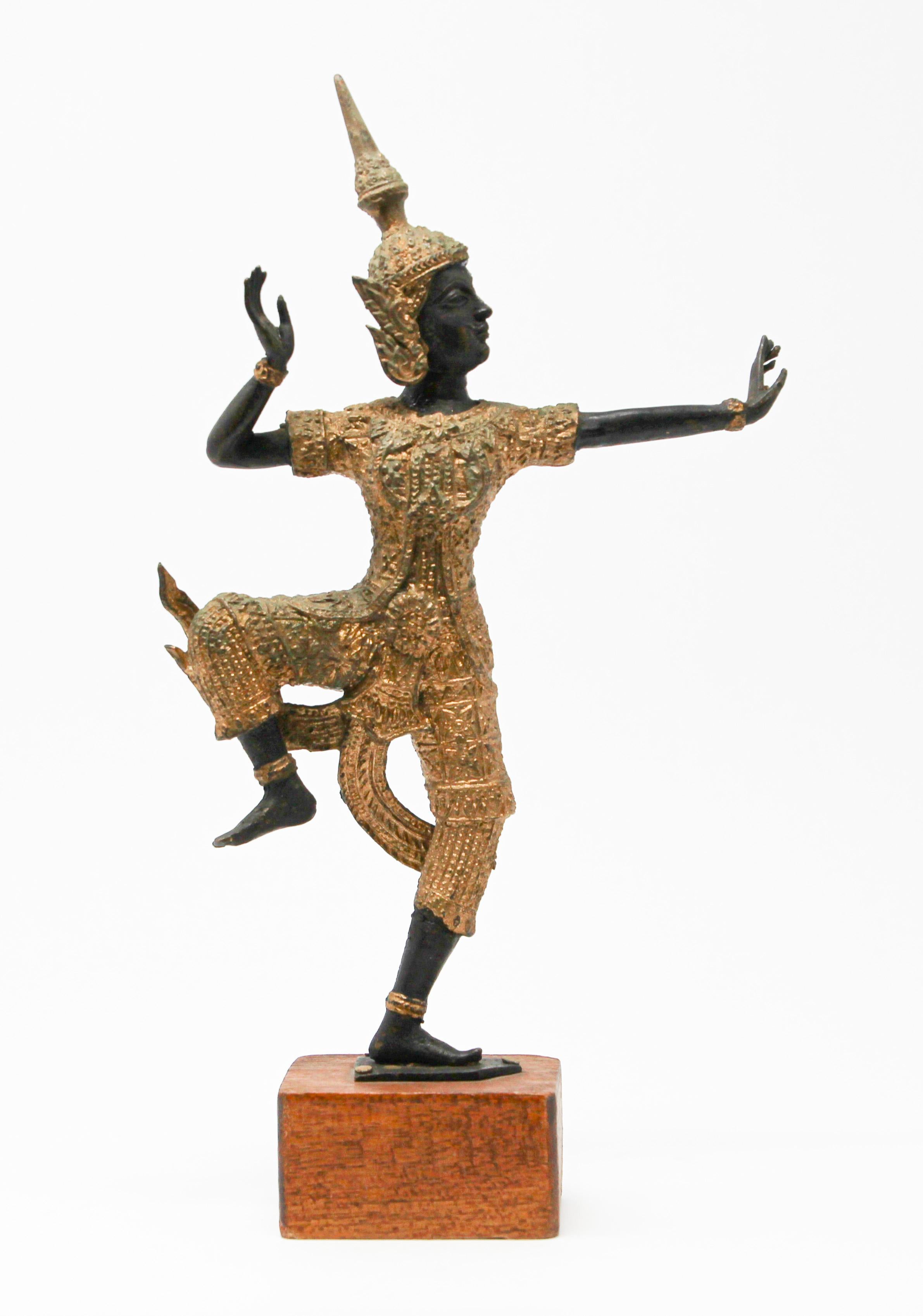 Vintage bronze statue in gold and dark green of Prince Rama dancing.
The Prince hero, Phra Rama (Rama), derived from Thailand’s national epic, Ramakien (Ramayana).
The figure is the distinguishing features of Khon, Thai classical drama. Smooth