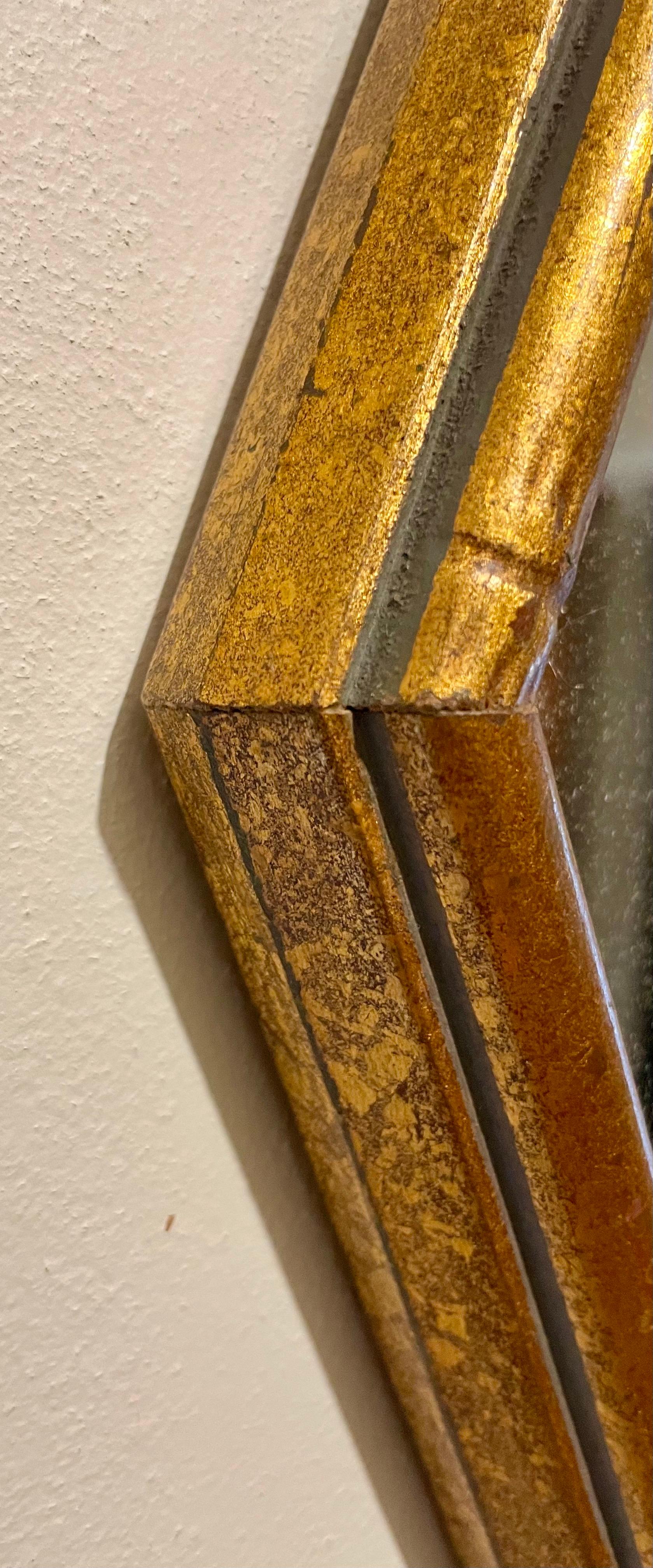 Gran espejo octogonal dorado de imitación de bambú. Mide 17,75