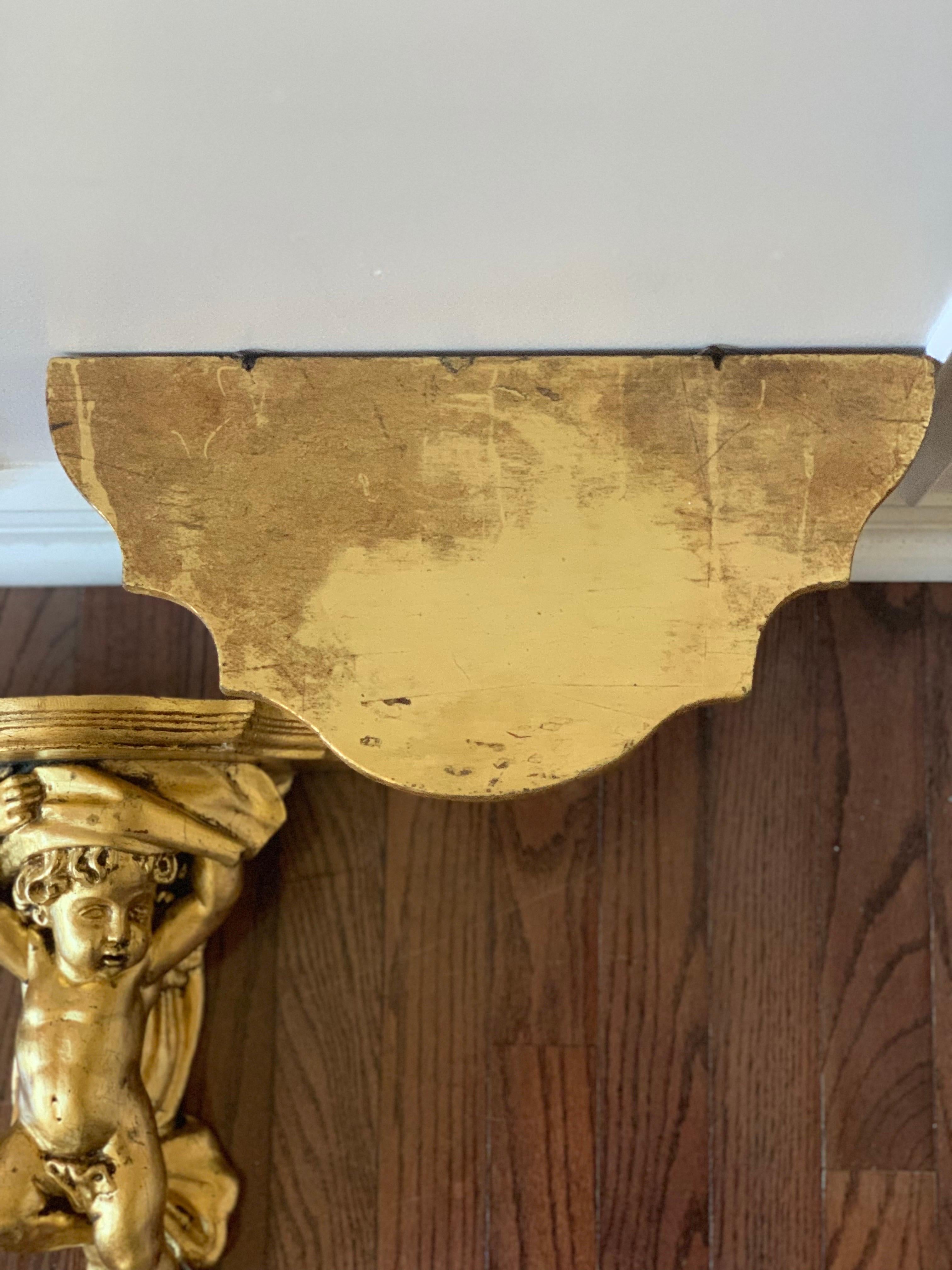Vintage Gilt Hand Carved Putti Cherub Wall Bracket Shelves, a Pair In Good Condition For Sale In Doylestown, PA