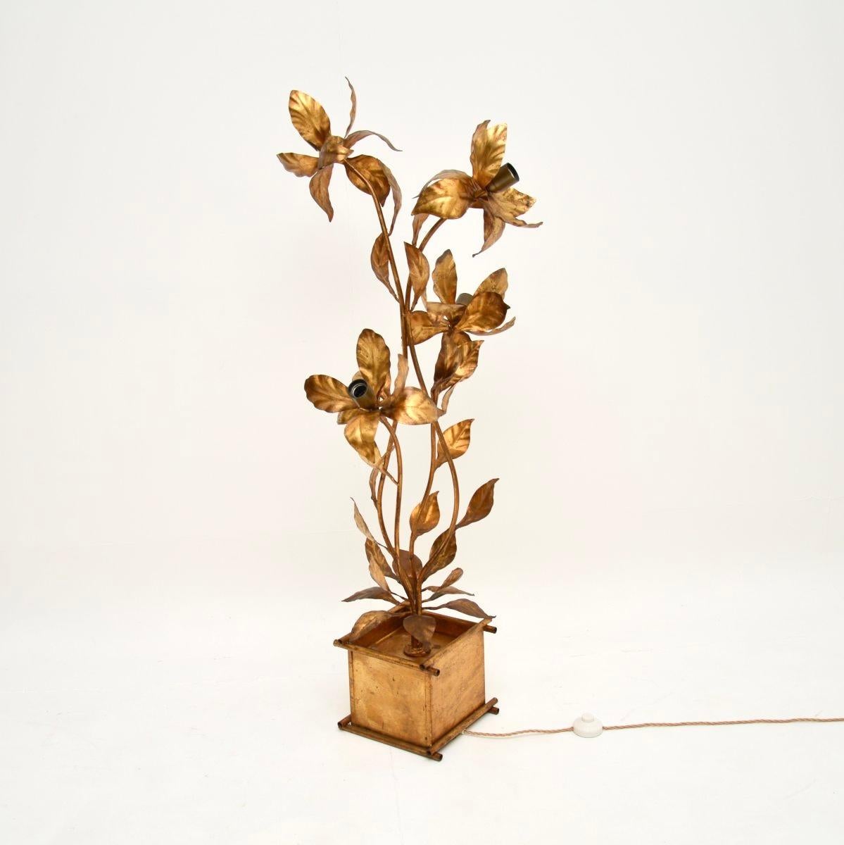 An absolutely stunning vintage gilt metal floor lamp by Hans Kogl, made in Germany and dating from the 1960’s.

It is beautifully designed and is of wonderful quality. The frame has gorgeous floral designs and is finished in gold, with four bulb