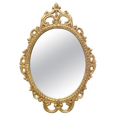 Specchio italiano d'epoca in metallo dorato