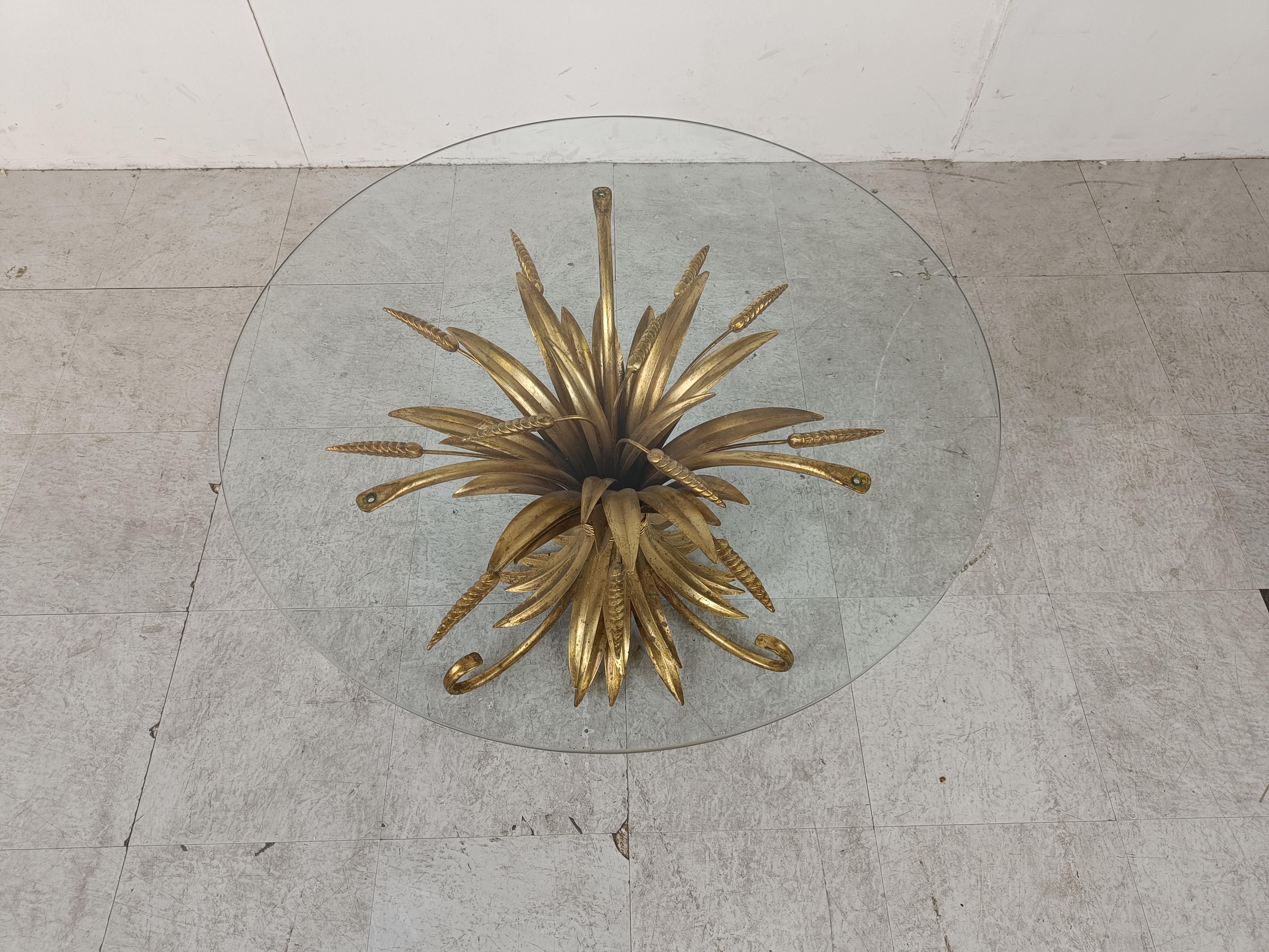 Vintage Coco Chanel coffee table or side table

The table is named after the famous fashion queen Gabrielle Bonheur Chanel.

Made of gilt metal with a round glass top.

The table is in very good vintage condition beautiful patina.

1960's -