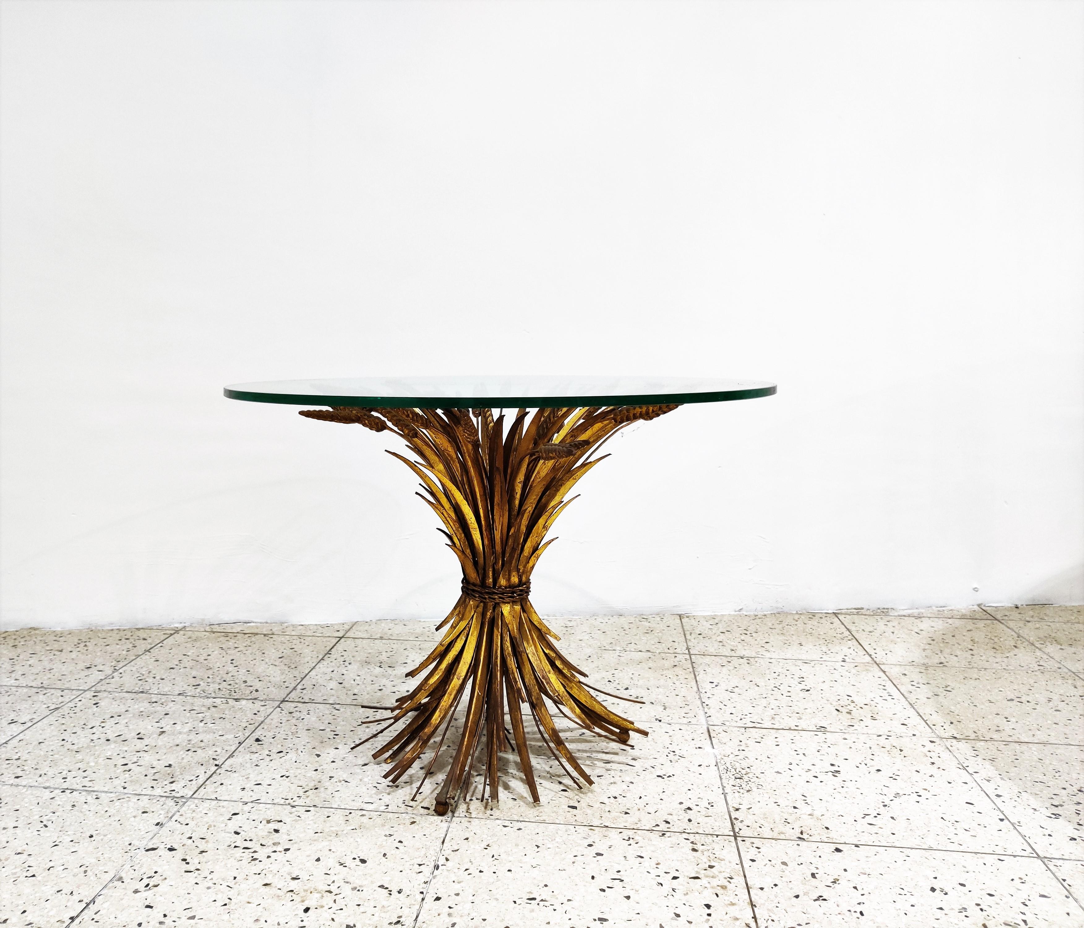 Vintage Coco Chanel coffee table.

The table is named after the famous fashion queen Gabrielle Bonheur Chanel.

Made of gilt metal with a round glass top.

The table is in very good vintage condition beautiful patina.

1960s,