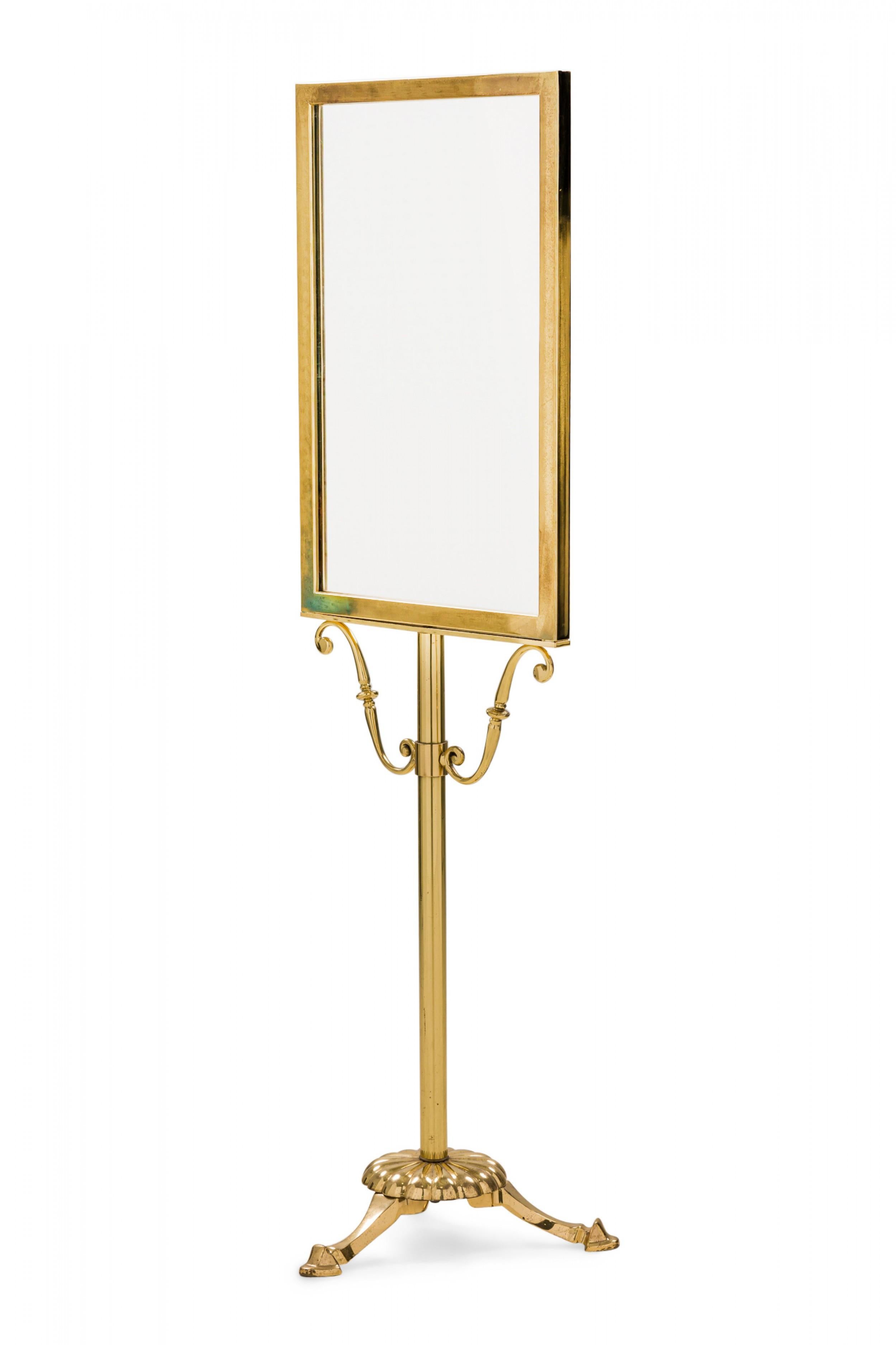 Vintage gilt metal menu / picture frame display stand with a rectangular upper frame supported by a tripod base with scrollwork detail and three small hoof feet.
  