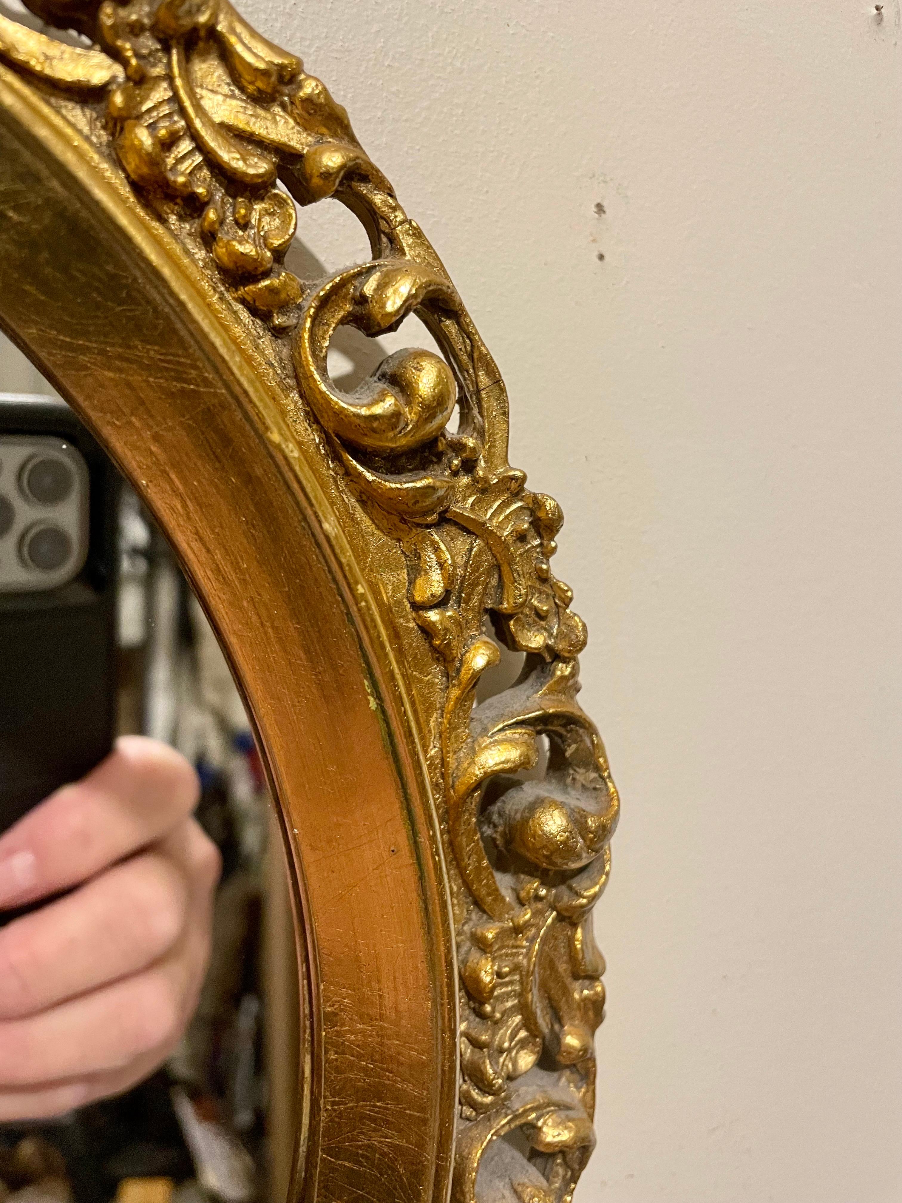 Hollywood Regency  Vintage Gilt Oval Carved Italian Mirror For Sale