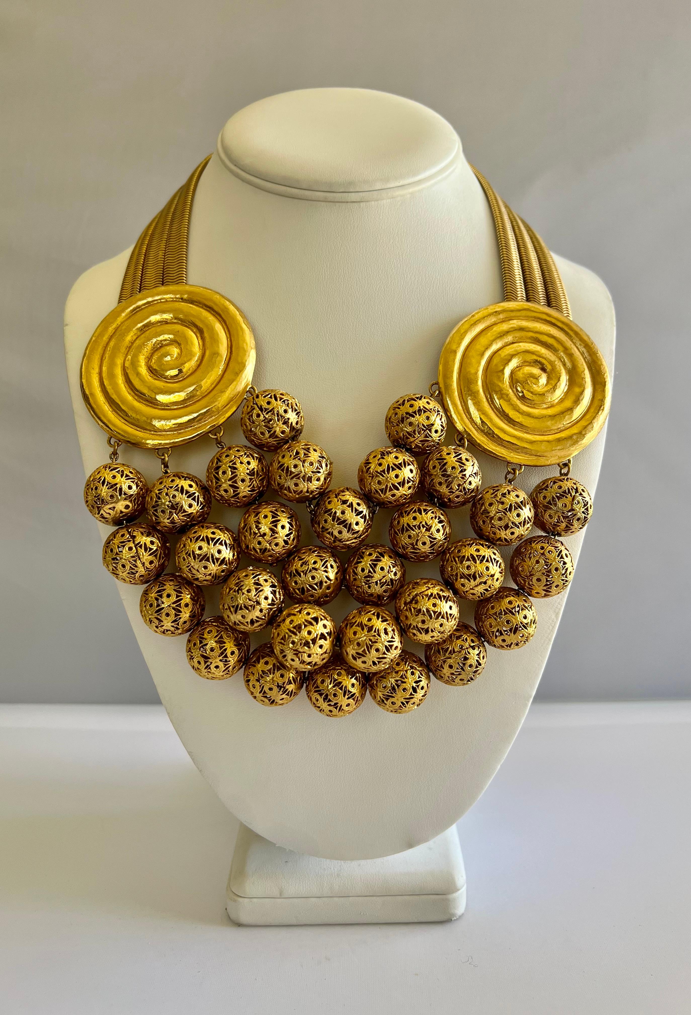 Scarce vintage gilt, Rochas Paris statement necklace circa the 1940s-1950s. This special ornate necklace was designed by Max Boinet and executed by Mr. Robert Goossens for Rochas, comprised out of gilt metal the statement necklace features romantic