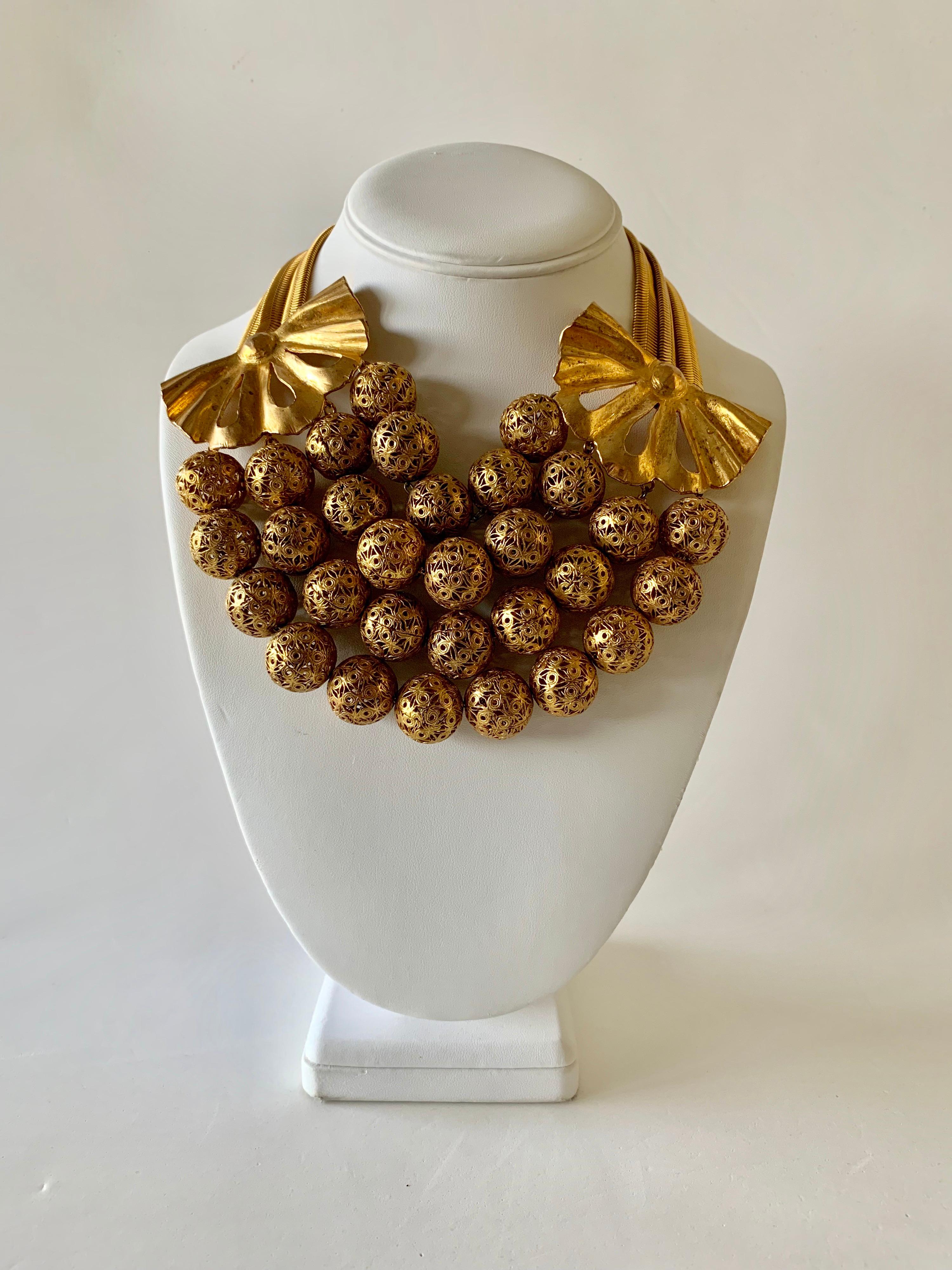 Scarce vintage gilt, Rochas Paris statement necklace circa the 1940s-1950s. This special necklace was designed by Max Boinet and executed by Mr. Robert Goossens for Rochas, comprised out of gilt metal the statement necklace features romantic yet