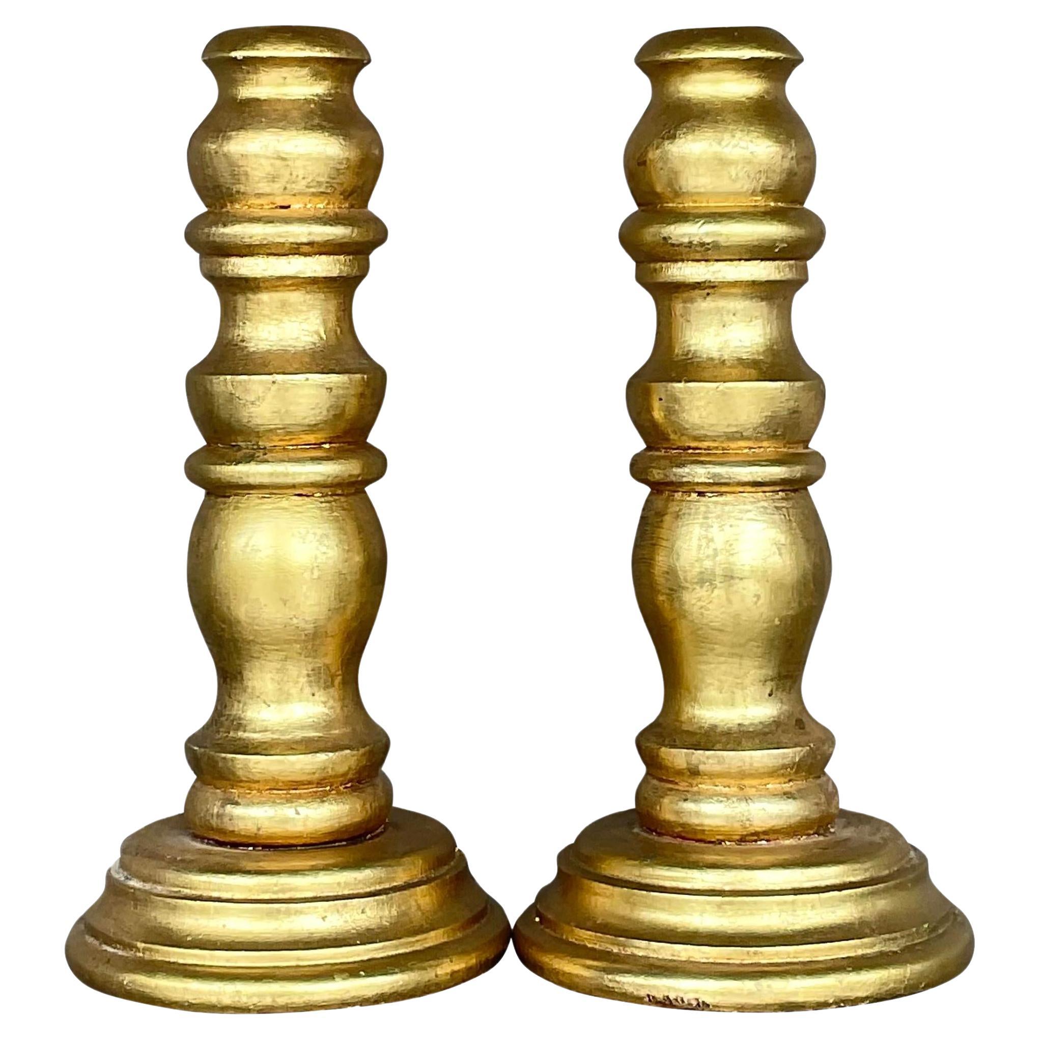 Paire de chandeliers vintage en bois tourné et doré