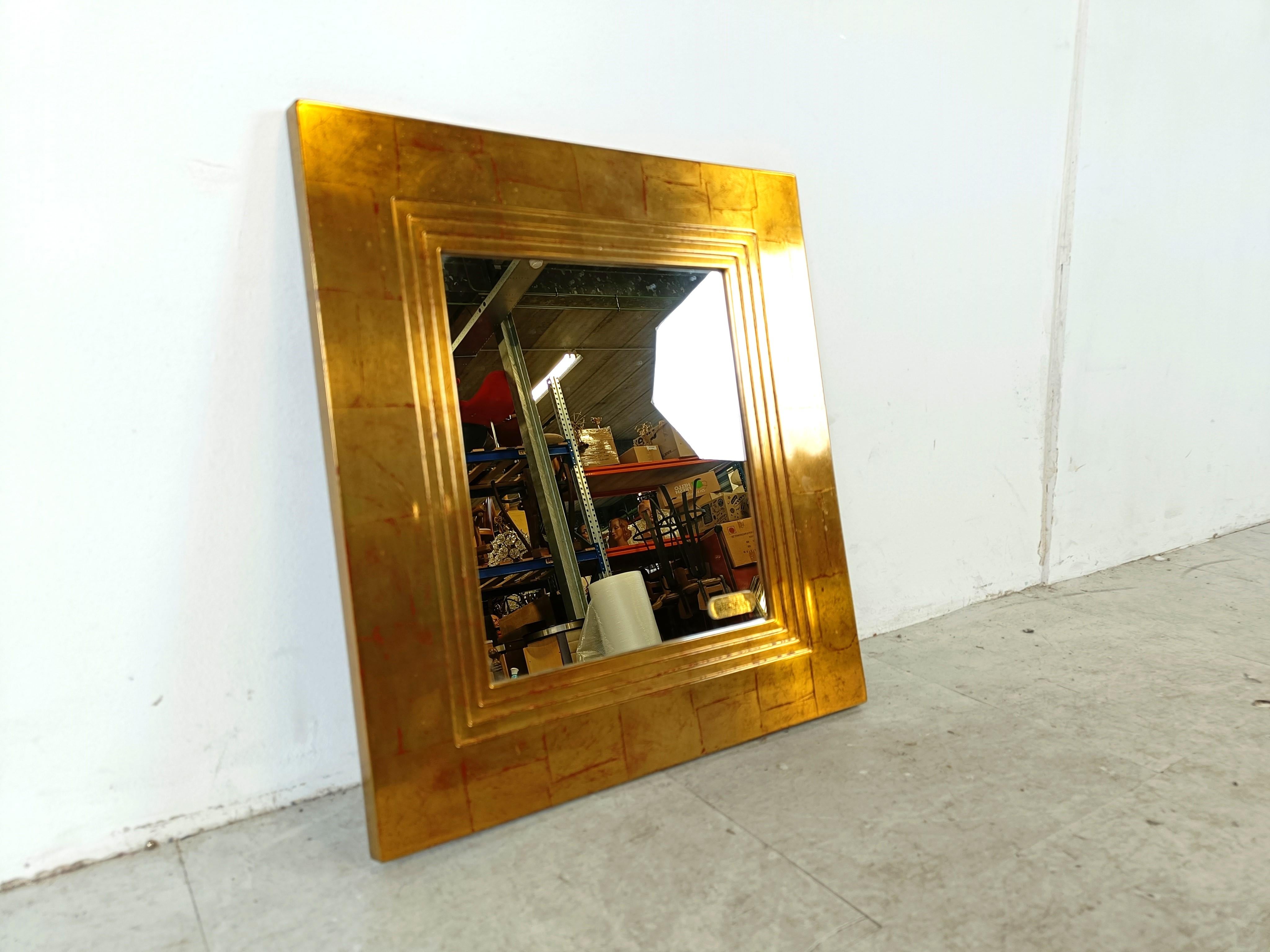 Seventies gilt wood mirror by Deknudt.

beautiful 3d styled frame.

Labelled on the mirror.

1970s - Belgium

Dimensions:
Height: 47cm/18.50