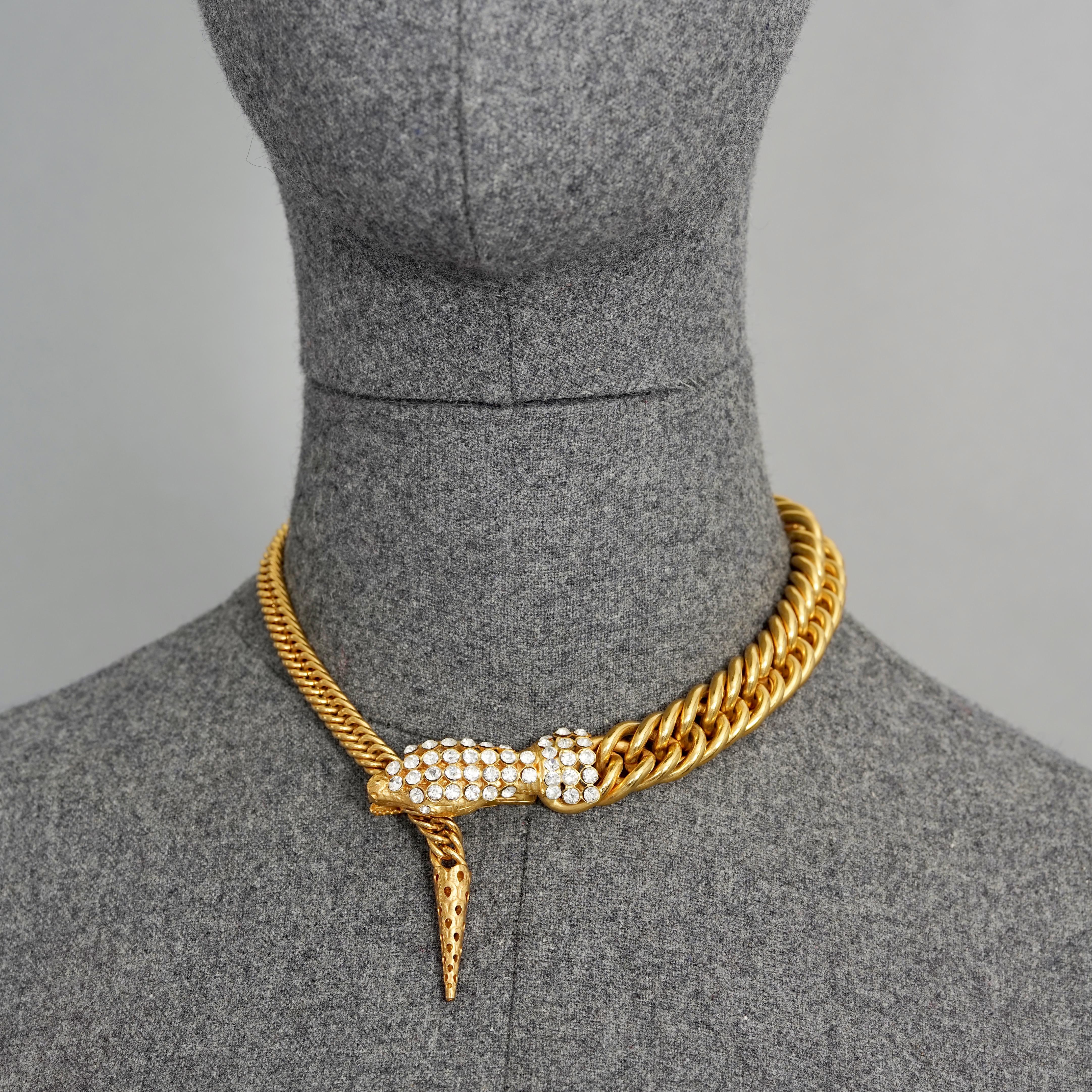 Vintage GIORGIO ARMANI Jewelled Snake Head Chain Necklace

Measurements:
Height: 0.67 inch (1.7 cm)
Wearable Length: 17.51 inches (44.5 cm) 

Features:
- 100% Authentic GIORGIO ARMANI.
- Chain necklace with snake head closure studded with