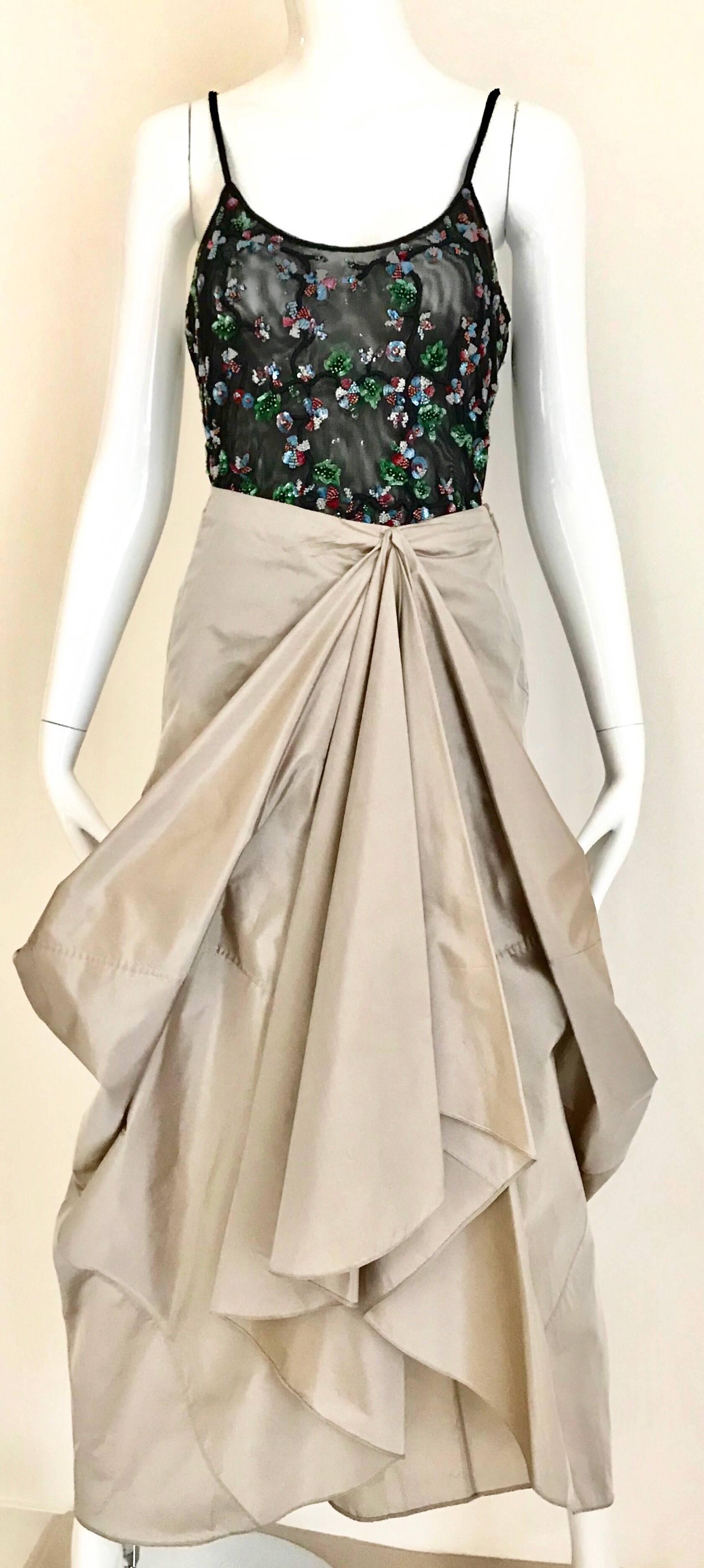 90s Giorgio Armani origami pleats silk skirt in light pewter.
Size Medium

Waist : 30”
Hip 44”
Length back hem 41”
Front hem 31”