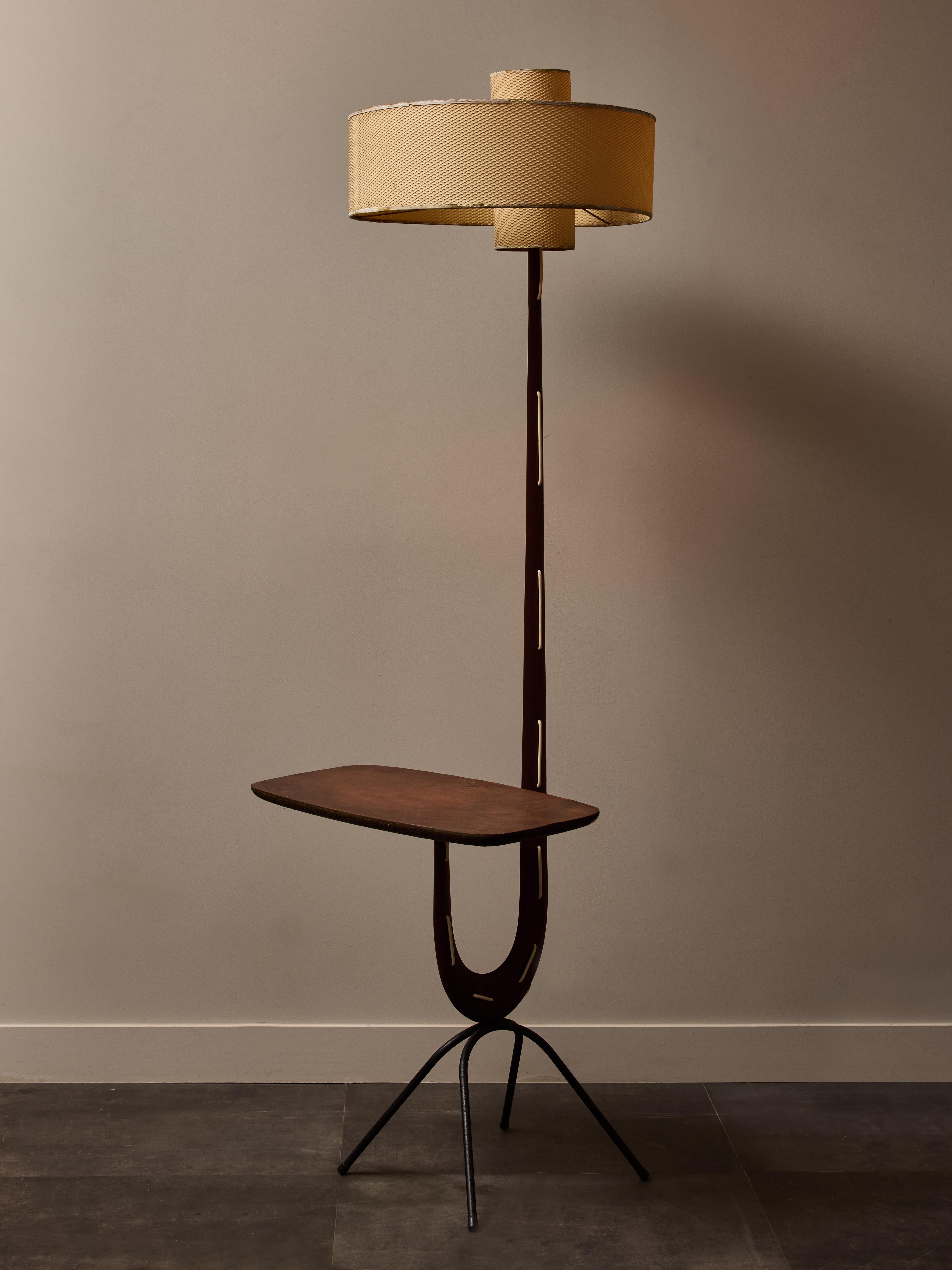 Girafe floor lamp designed and produced by Jean Rispal in the 1950s, made of wood and a two parts cellulose acetate lampshade. It is also equipped of a small integrated table, metal feet and a noticeable feature is the electric cable threaded in