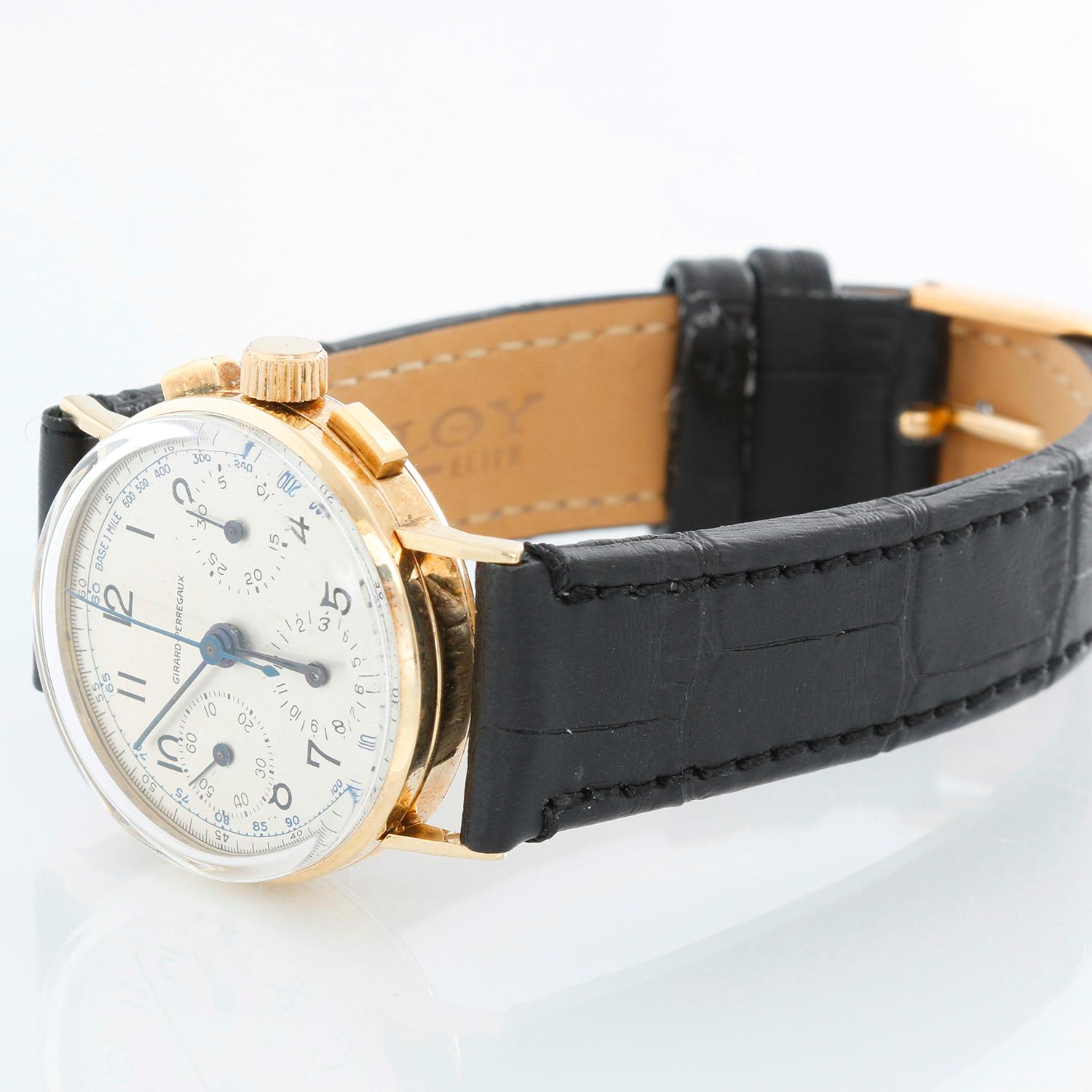 Vintage Girard Perregaux 14K Yellow Gold Boys Size Watch - Manual; Chronograph. 14K Yellow Gold (30  mm). Silver dial with Arabic numerals and subdials at 3 , 6, 9 o'clock. Black strap with tang buckle. Pre-owned with custom box. 
This watch will