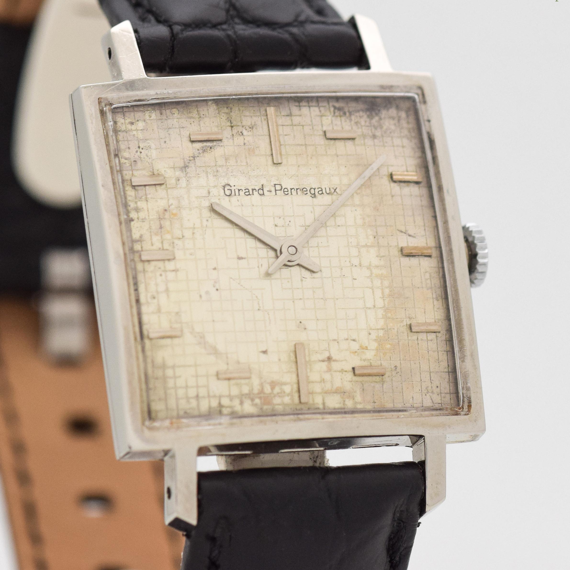 1960's Vintage Girard Perregaux Square Shape Stainless Steel watch with Original Silver Unique Pattern Textured Mini Squares Dial with Applied Steel Horizontal Bar Markers. 29mm x 40mm lug to lug (1.14 in. x 1.57 in.) - 17 jewel, manual caliber
