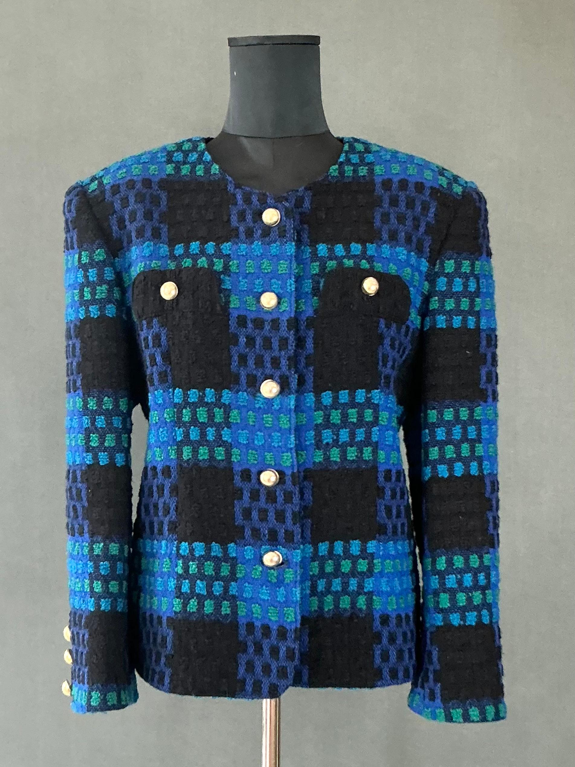 This Vintage Givenchy Blue & Black Tweed Blazer is an elegant, timeless piece that combines the best of luxury tailoring and classic design. Despite being in vintage condition, the blazer is still in excellent wearable shape and has retained much of