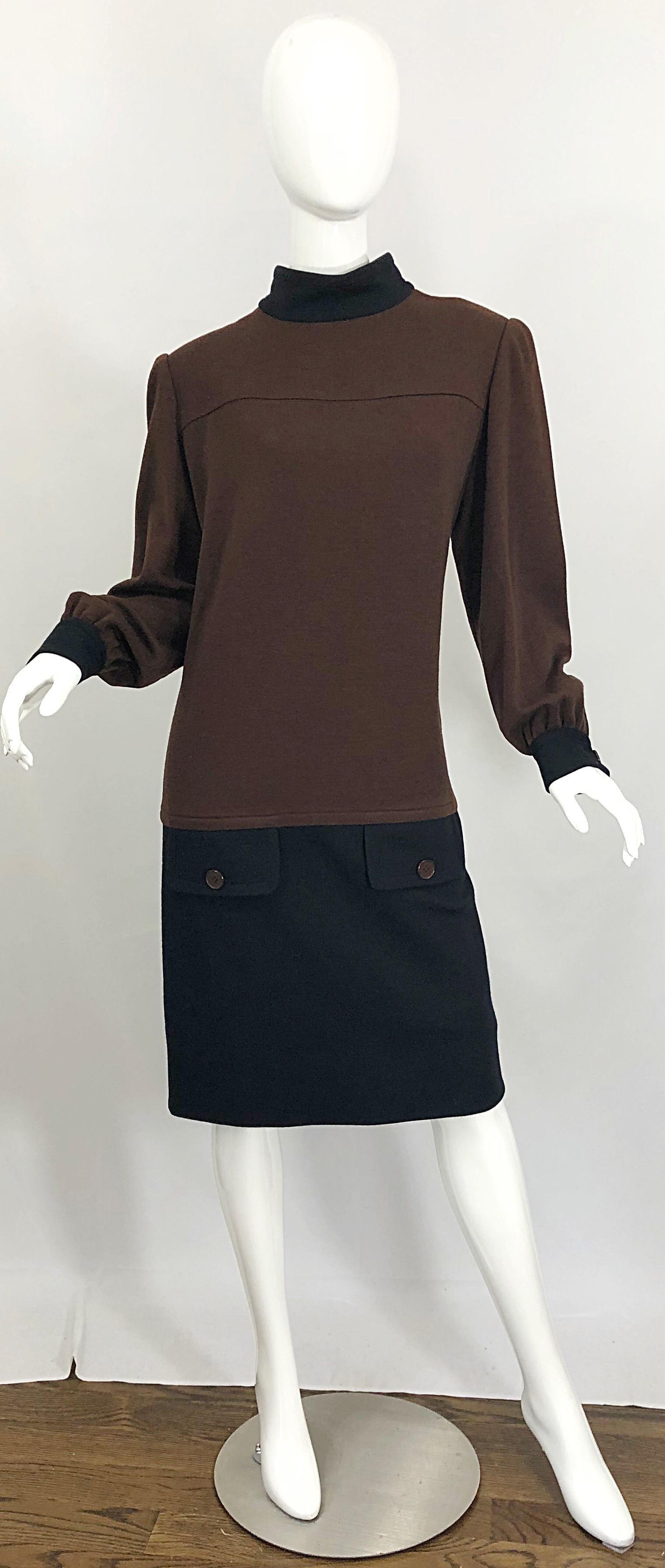 Chic vintage 1980s GIVENCHY brown and black virgin wool color block sac dress! Features a chocolate brown bodice with a black skirt, black collar, and black sleeve cuffs. Hidden zipper up the back with hook-and-eye closure. Can easily be worn day or