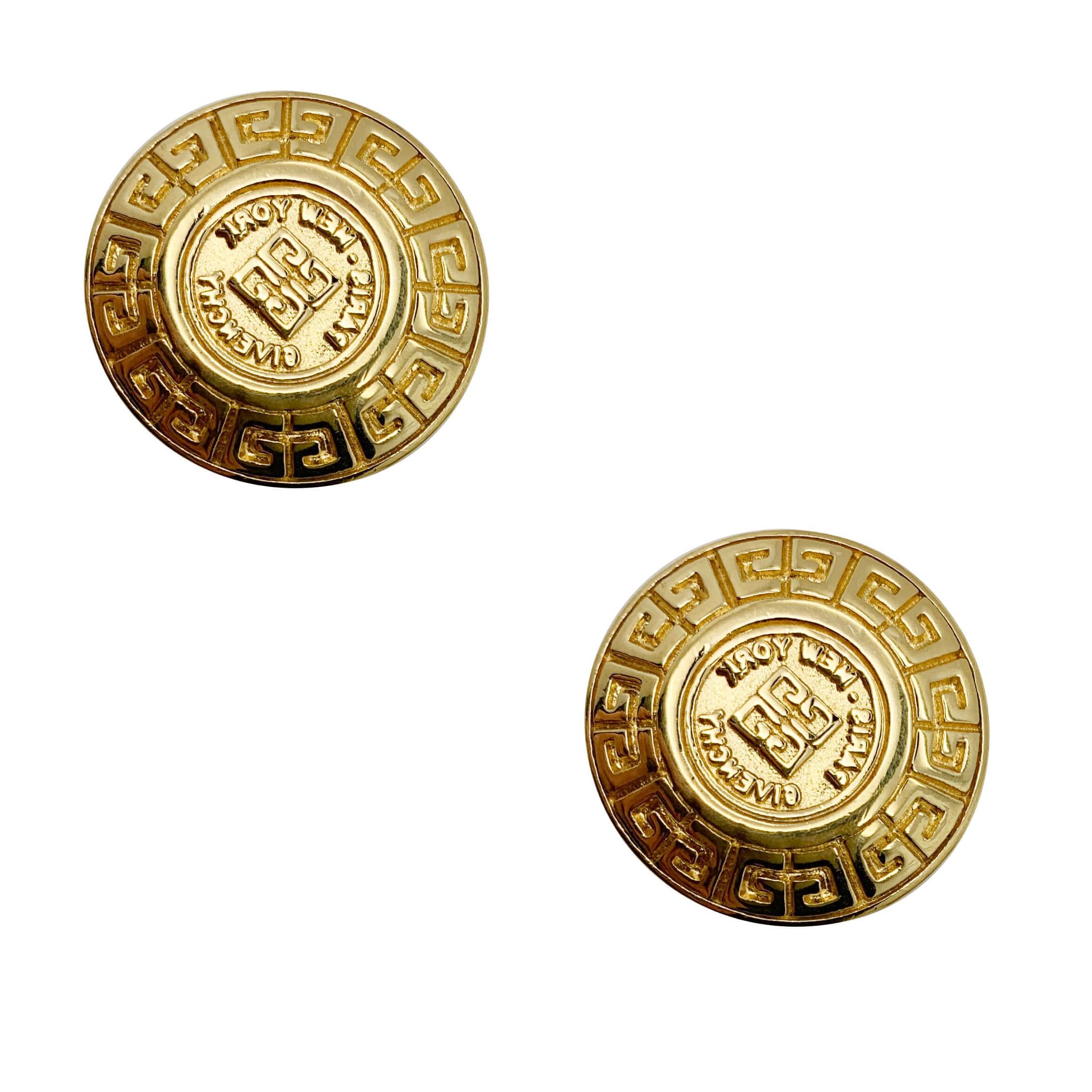 A pair of Vintage Givenchy Coin Logo Earrings in a disc style, adorned with the iconic 4G logo of the House

Vintage Condition: Very good
Materials: Gold Plated metal
Signed: Givenchy
Fastening: Clip
Approx. Dimensions: 2.2cms
The quintessential