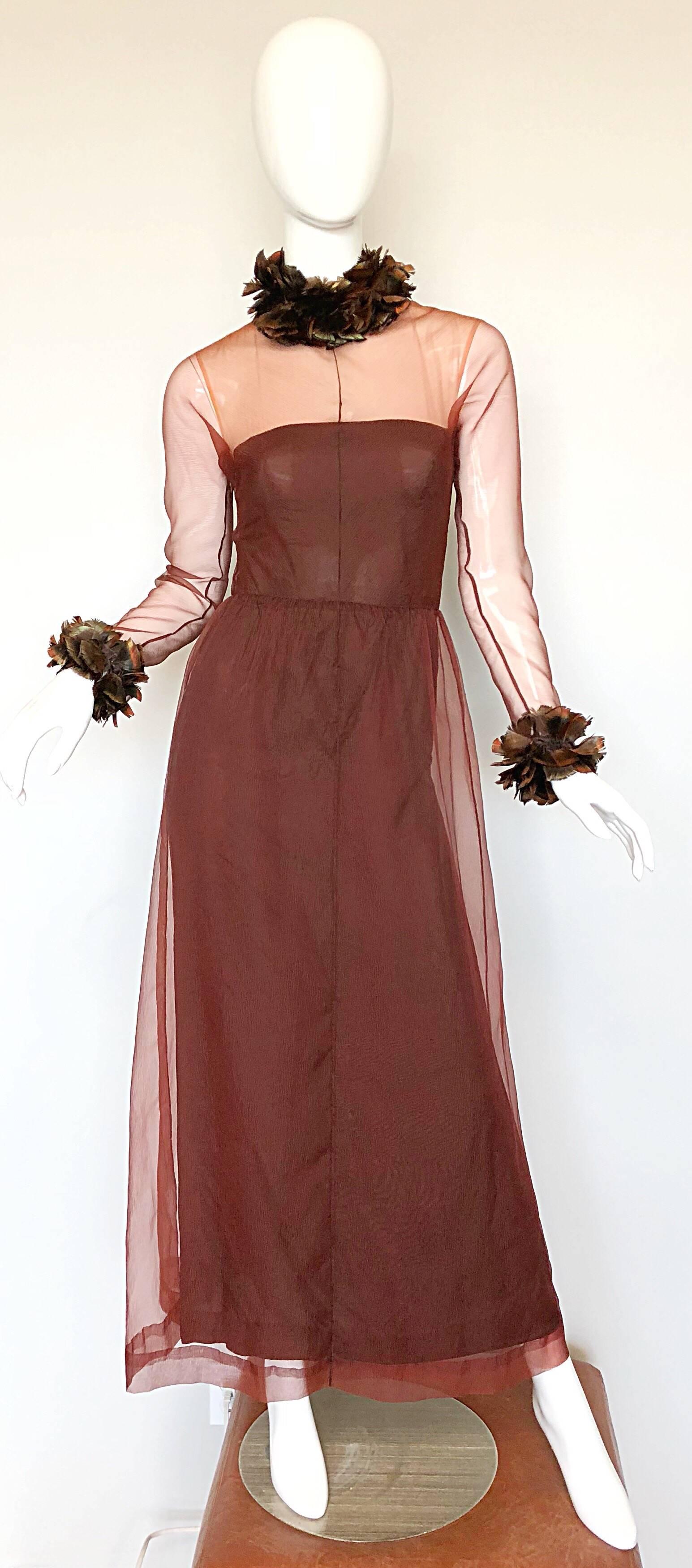 Amazing S/S 1971 GIVENCHY couture numbered chocolate brown silk chiffon evening dress! This early 70s dress is extremely well made. Features a nude illusion tailored bodice with semi sheer sleeves. Feathers around the full collar and sleeve cuffs.