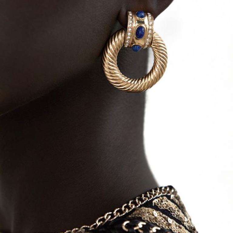 Incredible Vintage Givenchy Lapis Earrings. Designed in the eternally stylish door knocker style. Crafted in high quality gold plated metal and set with wonderful deep rich blue, cabochon lapis lazuli glass stones, accented with sparkling clear