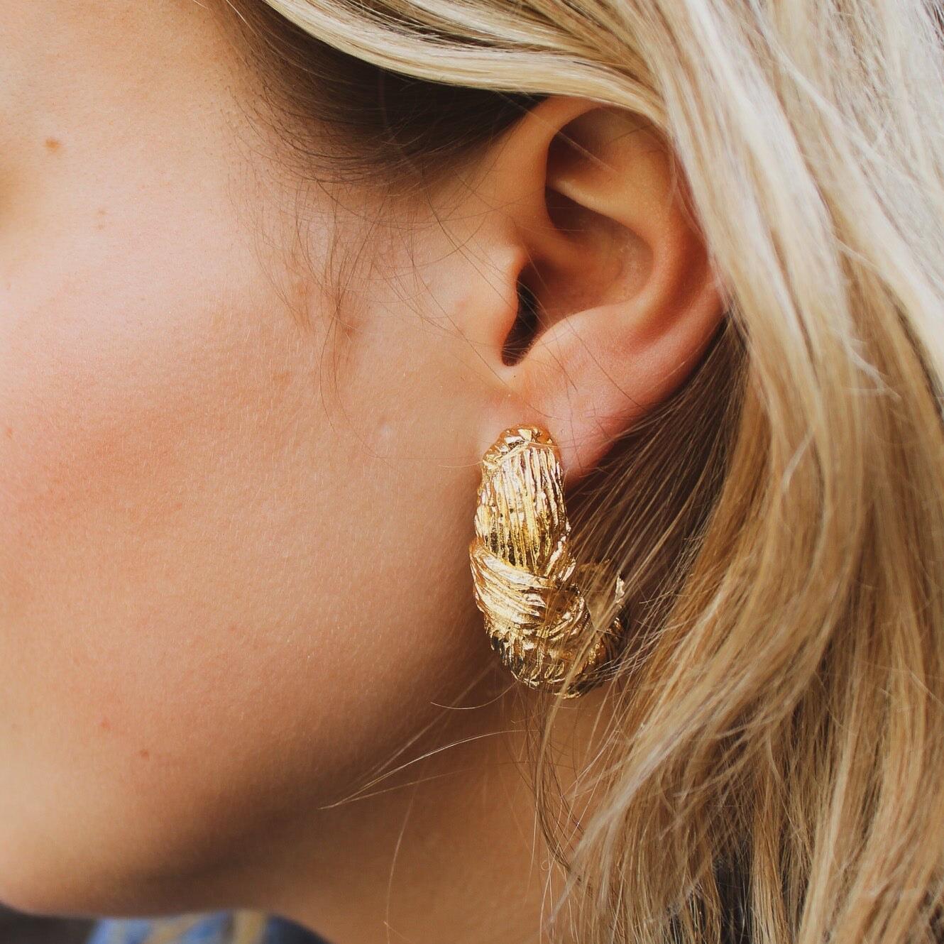 Vintage Givenchy Earrings 1980s for Pierced Ears

Add 80s vibes to your wardrobe with these Vintage Givenchy Earrings.

Crafted from high-quality gold plated textured metal, these earrings were made in France in the early 1980s and are a dead stock