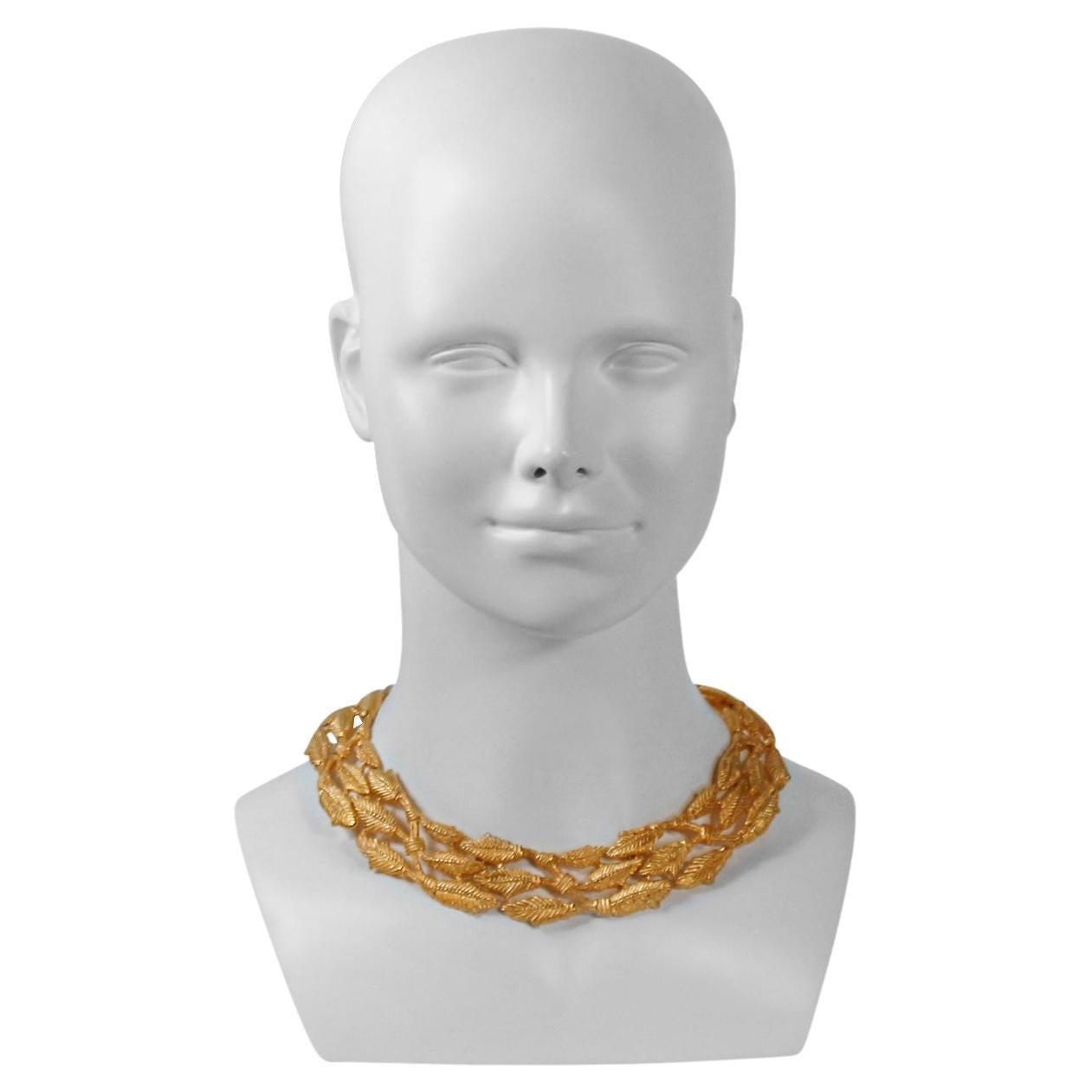 Vintage Givenchy Gold Necklace with Wheat Pattern interspersed around in three rows. Textured.  There are Hoops on my site that Match. Wheat is the symbol for abundance.  This necklace is far more magnificent in person. 
Worn with the hoops or any