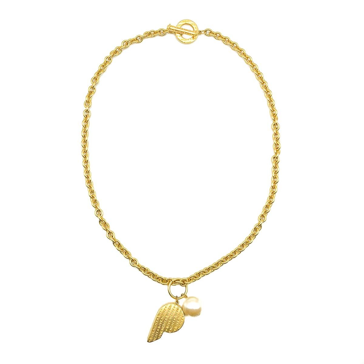 A spectacular Vintage Givenchy Whistle Necklace. Most at home on the catwalks of the 1990s. Crafted in extremely high quality gold plated metal with simulated pearl. A weighty large link chain is finished with an oversized monogrammed toggle