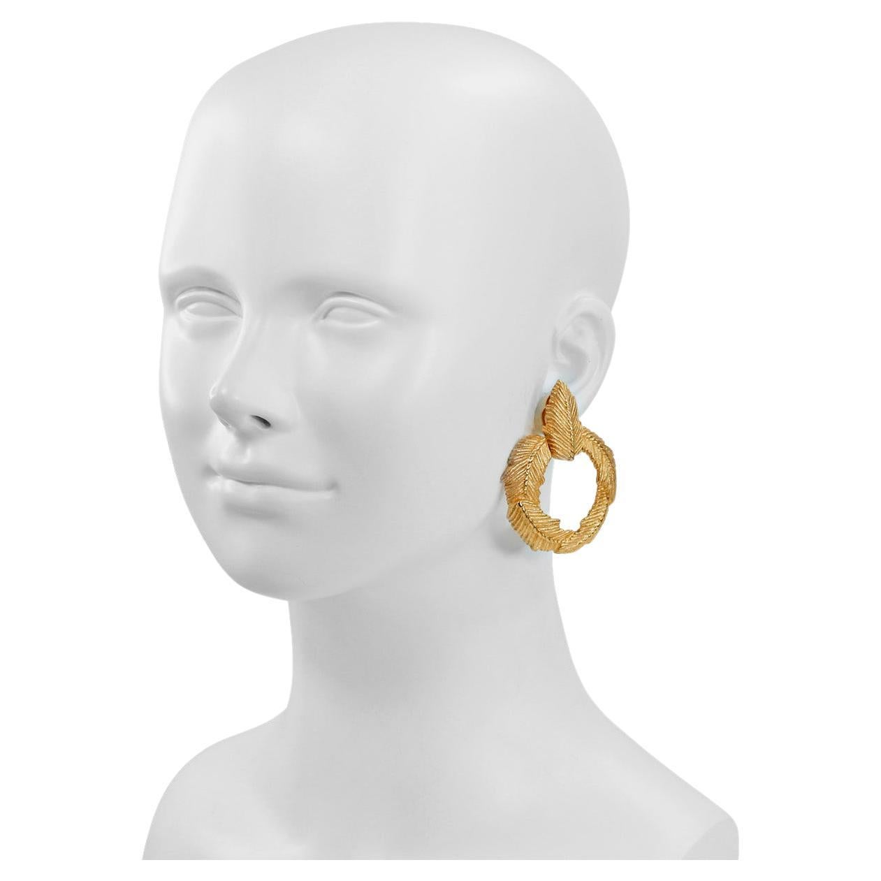 Vintage Givenchy Gold Tone Feather Like Front Facing Hoop Earrings.  Clip On. There is a Necklace on Site as well that matches.

Again, I say these are the sleeper earrings but when you see them on they are wow. Front facing so they make a