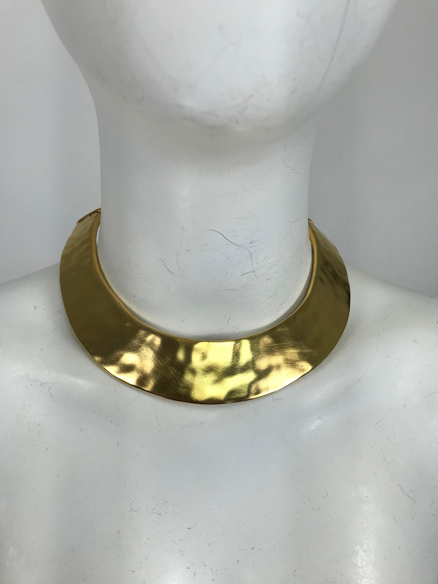 Vintage Givenchy hammered gold metal collar necklace from the 1990s. Arty hammered gold metal collar with a fine brushed, collar is hinged at each back side. In very good pre owned condition. 
Measurements are in inches:
13 at upper neck
1 1/8 wide