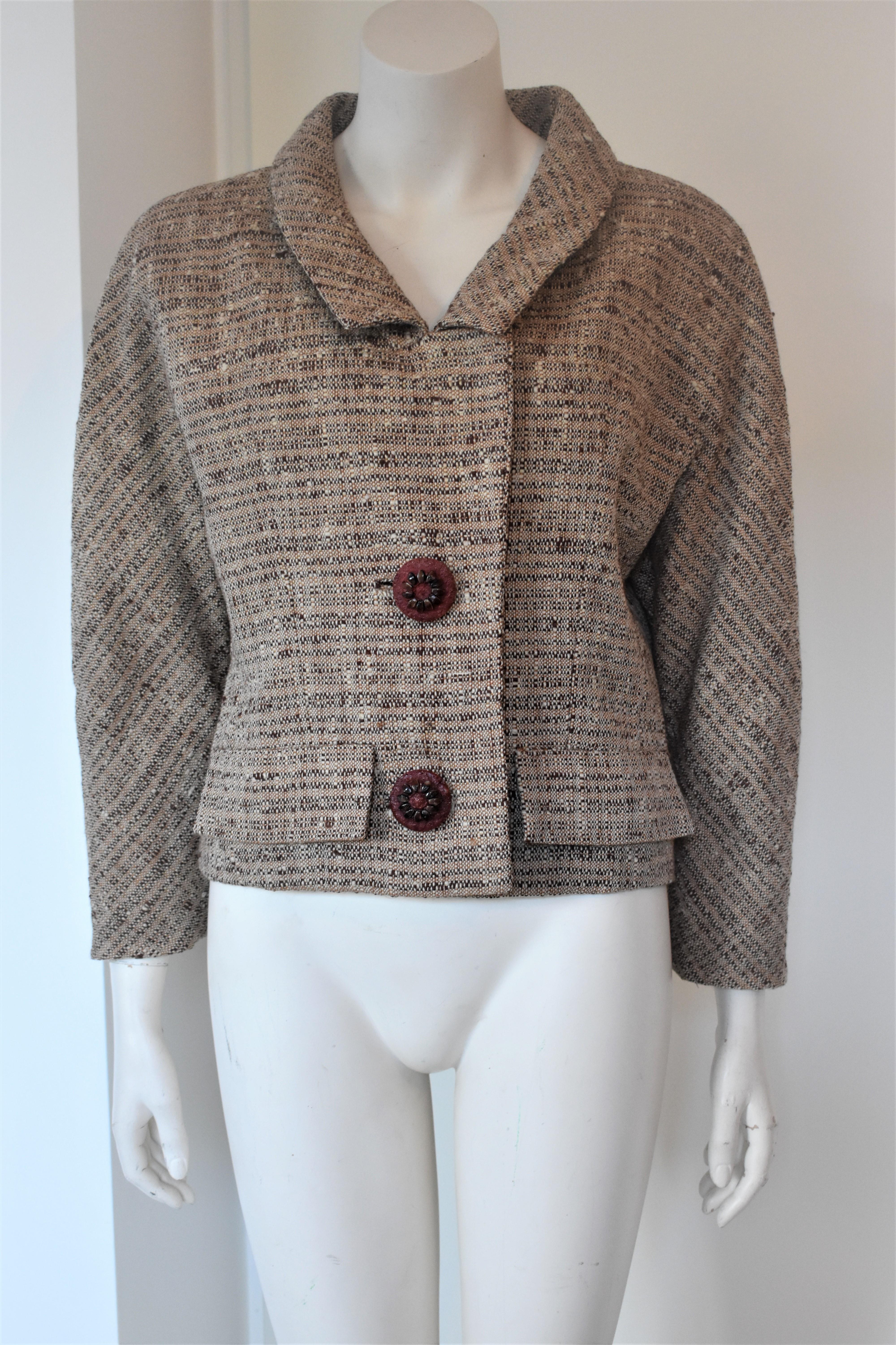 This tweed jacket is very old and extremely rare. It is an authentic Givenchy Haute Couture dating back to circa 1958. Similar jackets were worn and adored by famous style icons Audrey Hepburn and Jackie Kennedy. It is in very good condition,