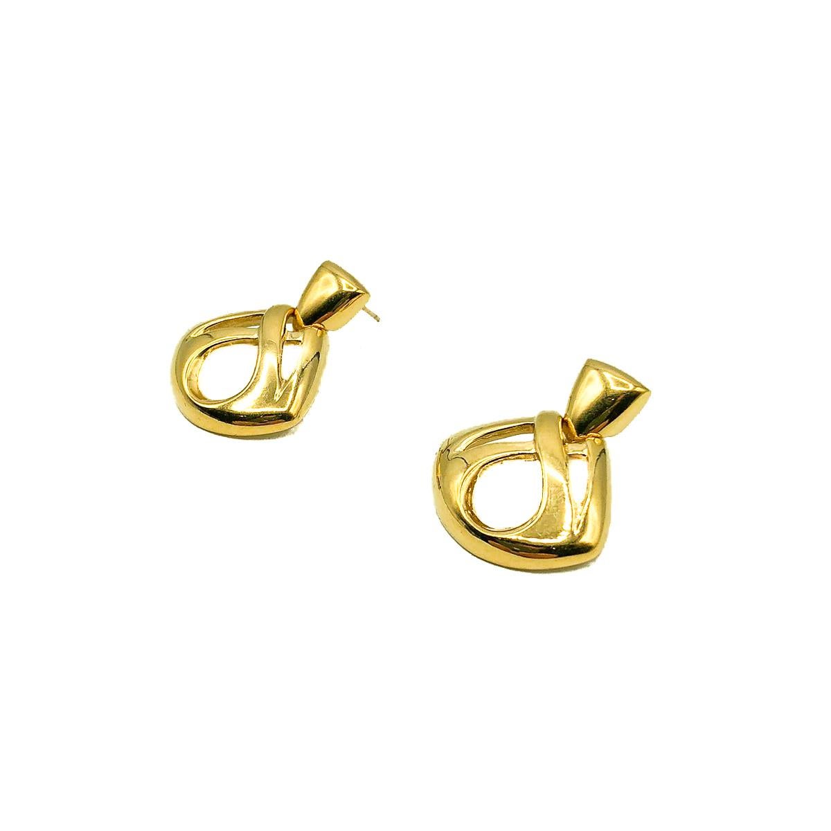 Vintage Givenchy Infinity Earrings. One of the late great 20th century couturiers, Hubert de Givenchy founded his namesake fashion house in 1952, destined to leave an indelible mark on fashion history. Famed for disrupting fashion codes of the time