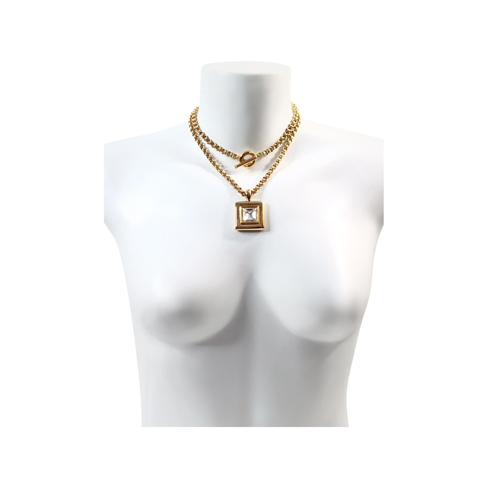 Vintage Givenchy Link Chain with Dangling Drop Necklace Circa 1980s. Toggle Closure offers a wide range of options.  Wear it long or wrapped with the toggle in the front or the back, or as a lariat. A classic look from Givenchy.  The heavy square,
