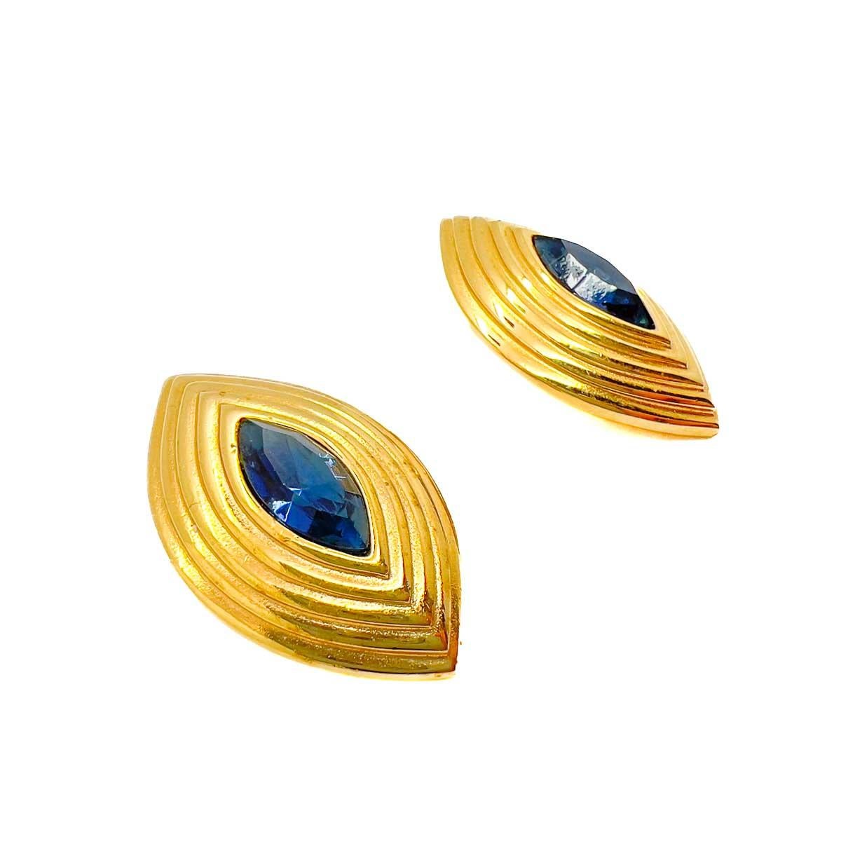 A pair of Vintage Givenchy Marquise Earrings. Featuring a lustrous metal tiered mount set with a classic sapphire marquise crystal. The epitome of couture chic that will elevate your look every time.
One of the late great 20th century couturiers,