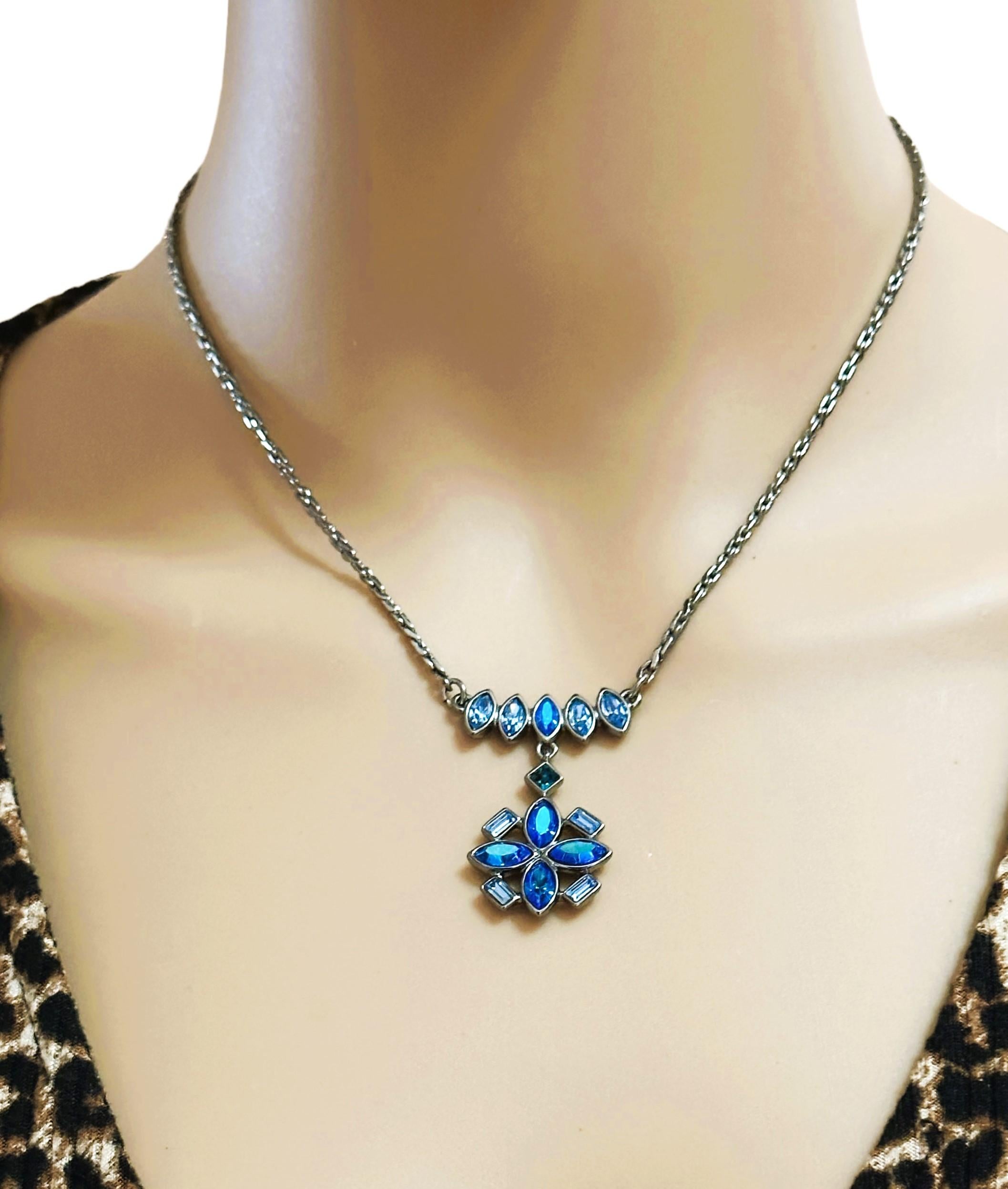 This is a gorgeous Vintage Givenchy Necklace with Variations of Blue stones that are different shapes and sizes.  It is masterfully made with an exquisite  design.  The clasp is marked 