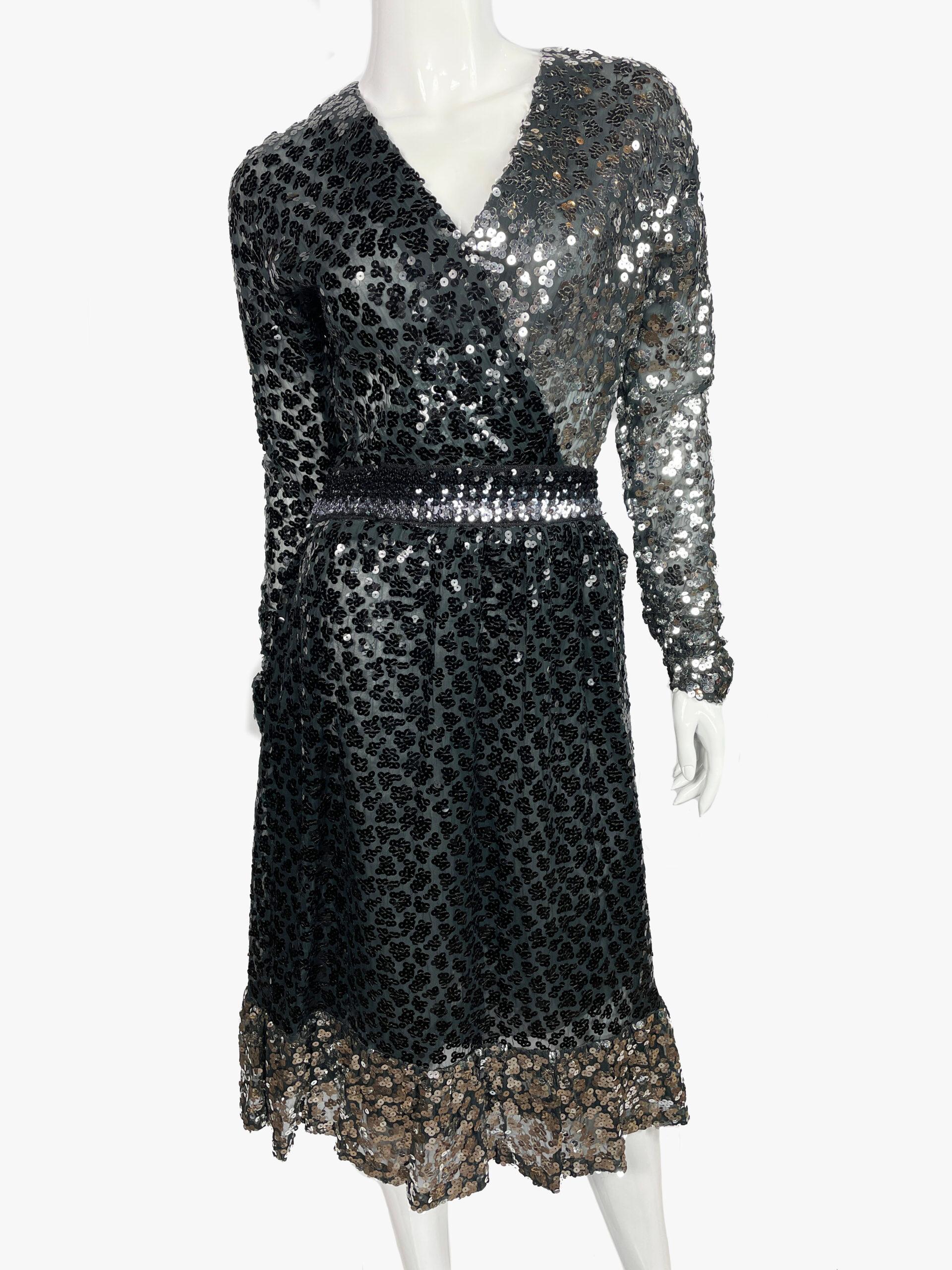 Vintage Givenchy Nouvelle Boutique demi couture A-line dress from 1980’s collection.

Sequin embellishments, long sleeve with V-neck.

Size not listed, estimated from measurements.
Hip: 34”/86.5 cm
Length: 44”/112 cm
Waist: 24”/61 cm
Bust: 32”/81