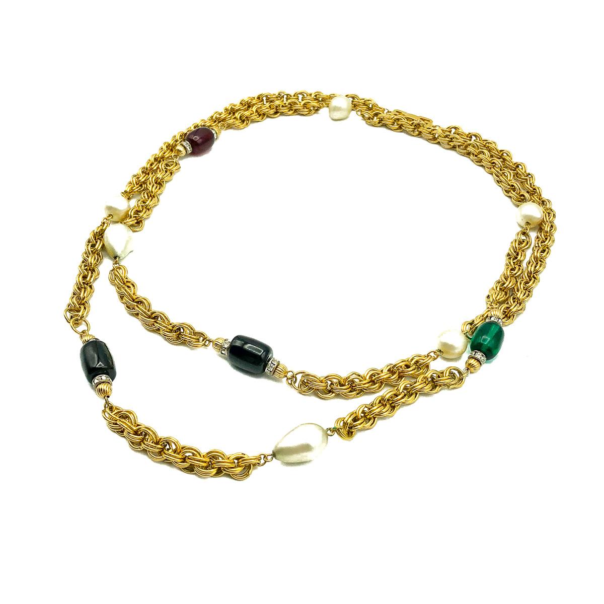 A stand-out vintage Givenchy Poured Glass Sautoir. Crafted with gold plated metal, poured glass/pate de verre pearls and glass paste embellished rondelles. Featuring a long fancy link chain interspersed with ruby red, emerald green and onyx black