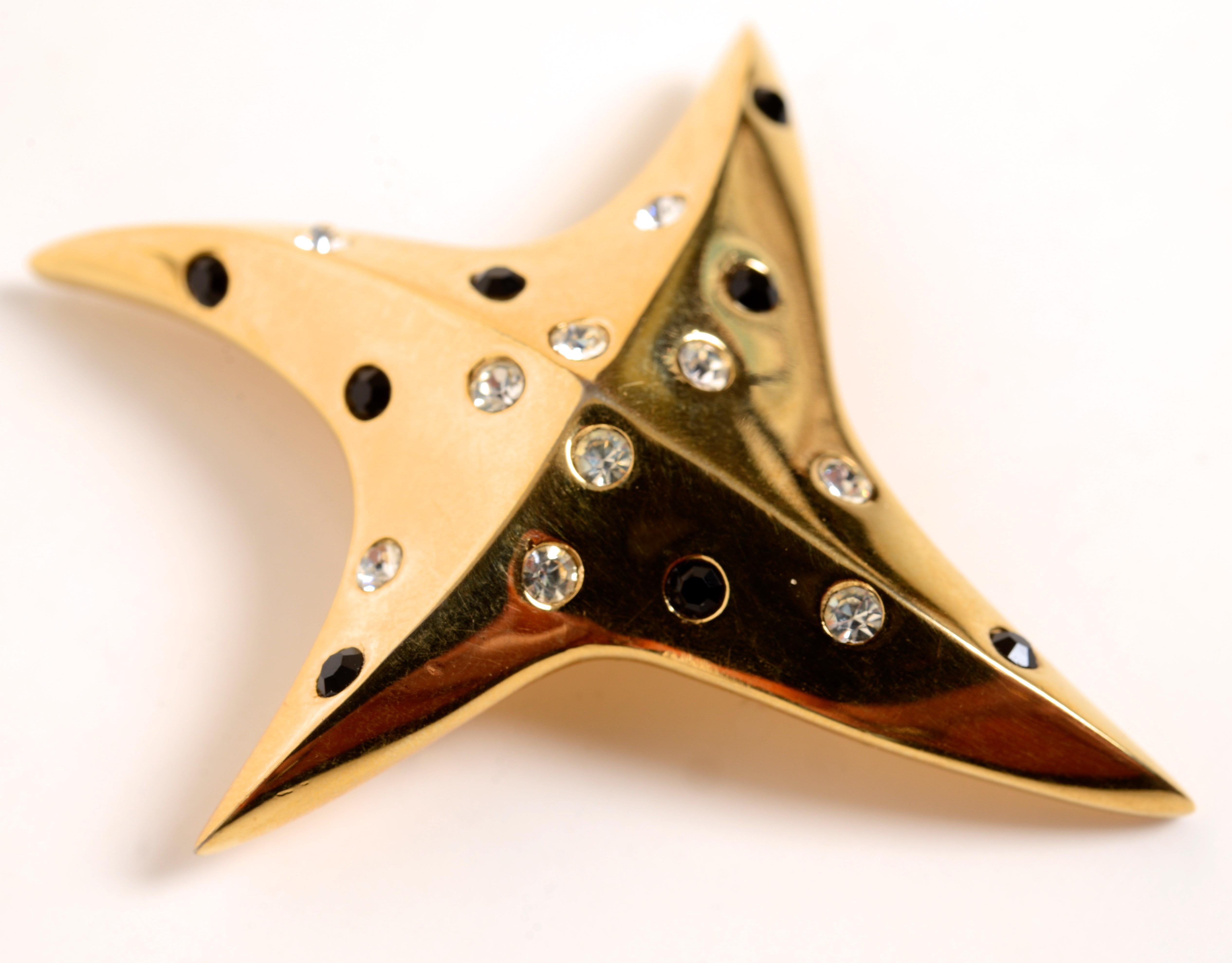 Vintage Givenchy Star Brooch c1980. The brooch is gold plated with clear rhinestones and faux sapphires and is stamped 'Givenchy Paris New York 1980' on the reverse. With locking pin back. This is unusual with faux rhinestones and sapphires, most
