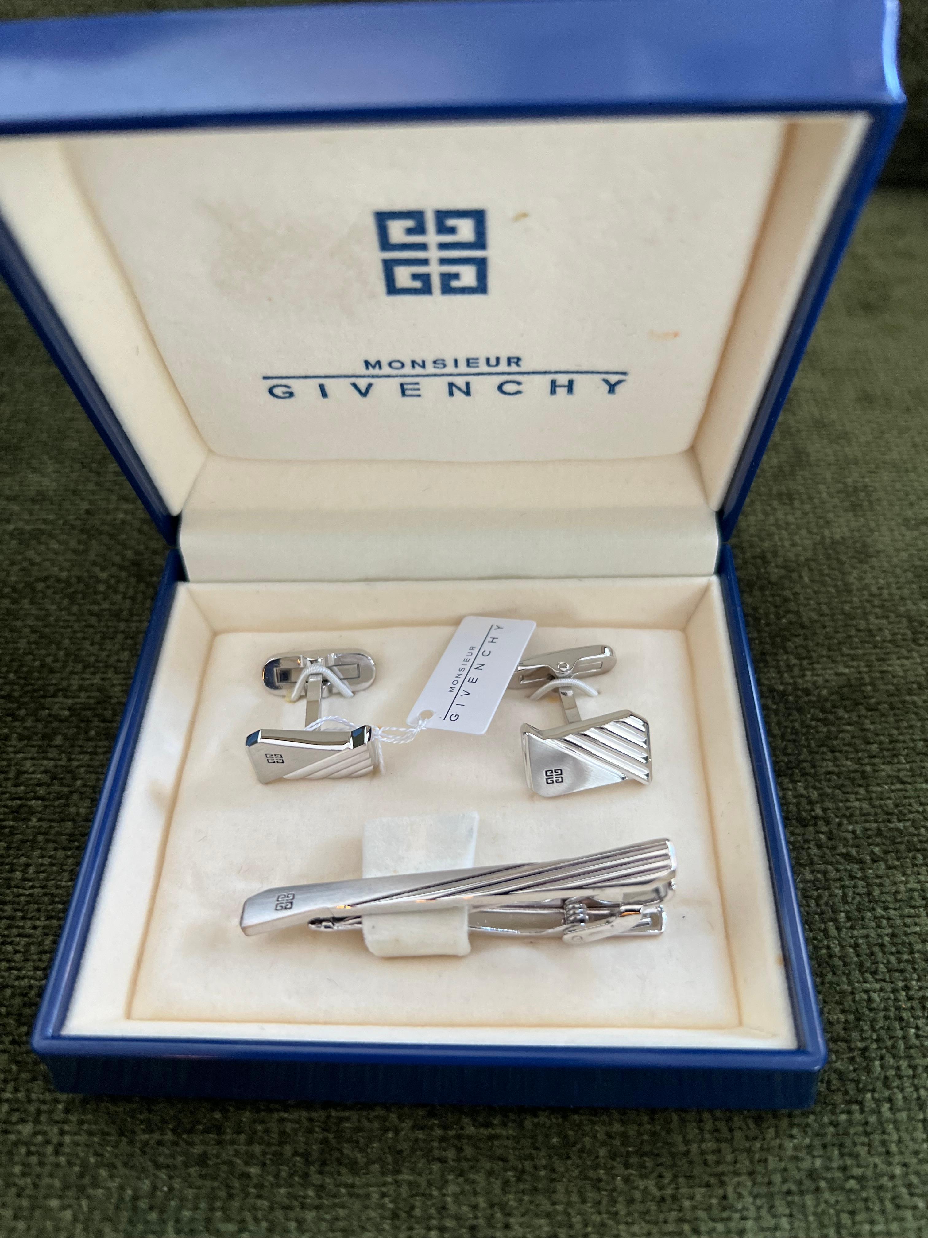 Vintage Givenchy Steel Logo Cufflinks, Tie Clip Brand Mark Emblem “Circa 1990” In Excellent Condition In New York, NY
