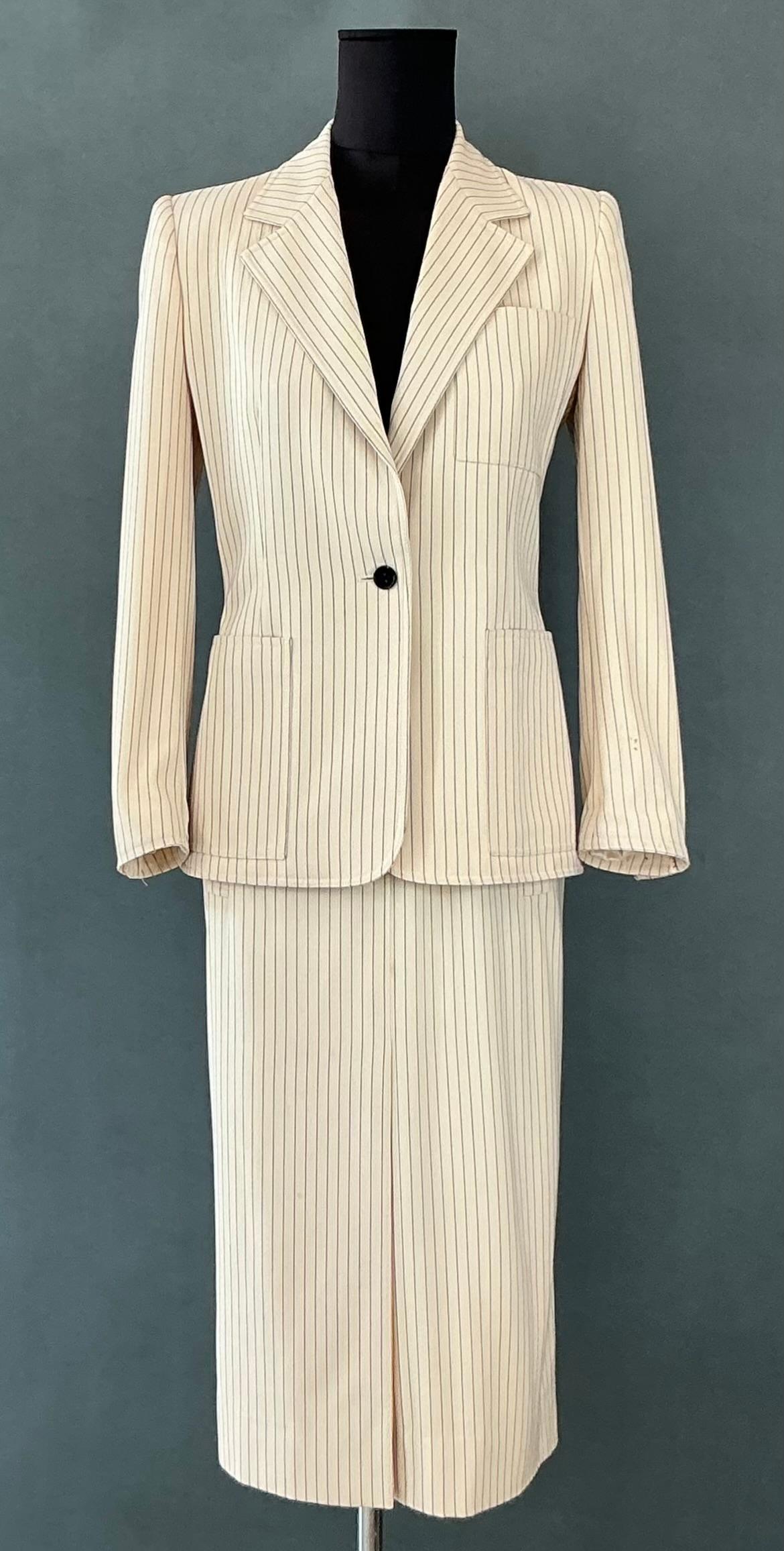 The Vintage Givenchy Pinstripe Blazer Set is a timeless classic that represents the high level of craftsmanship and style Givenchy is known for. Its striped pattern offers a sophisticated yet bold aesthetic, while the tailored fit ensures a