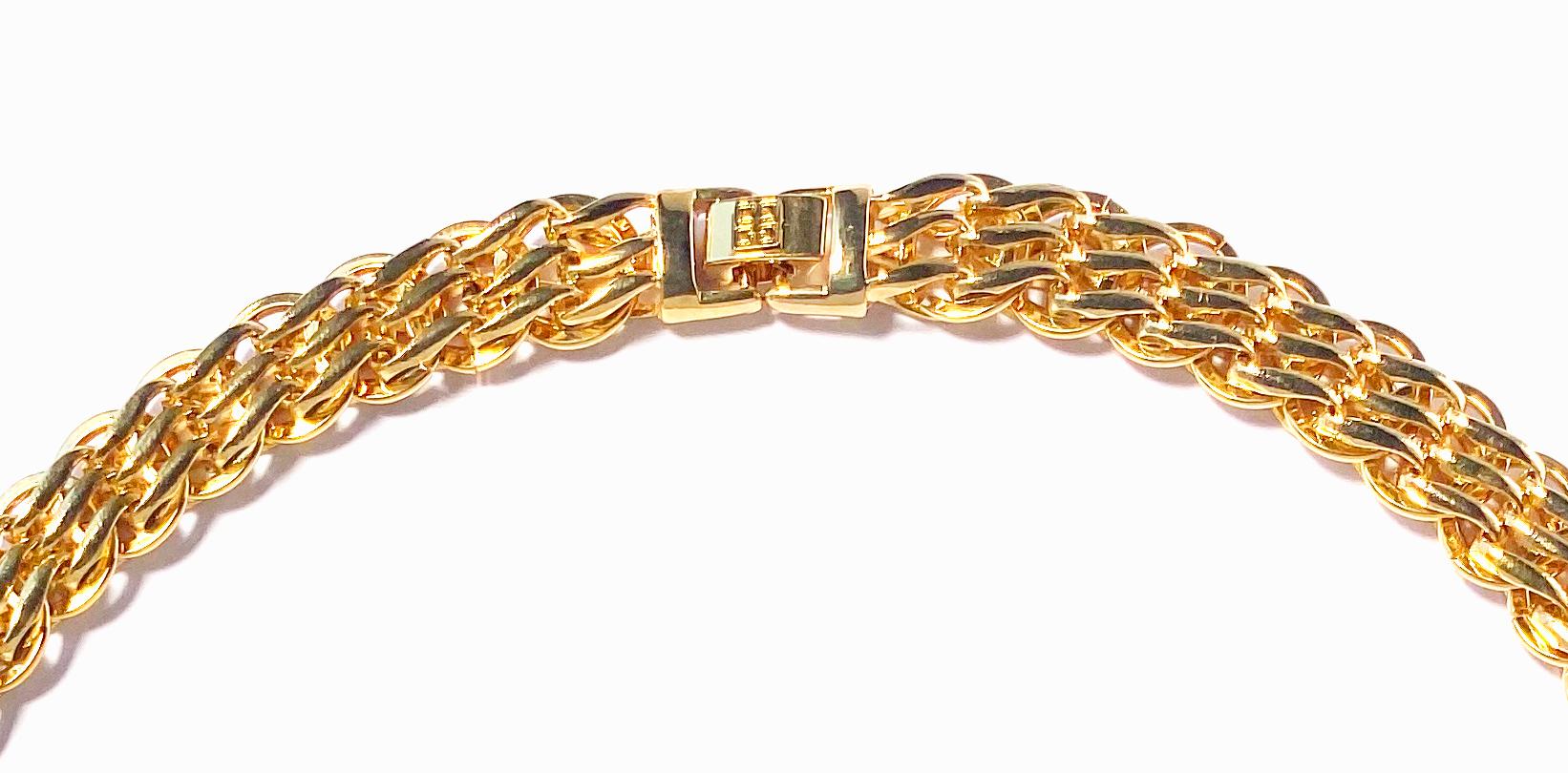 Vintage 1980s Givenchy chain necklace in gold plate.  This short length heritage necklace comprises a flat, wide triple-linked chain with a Givenchy logo clasp.  Length 18 inches, width just under half an inch with a foldover clasp closure featuring