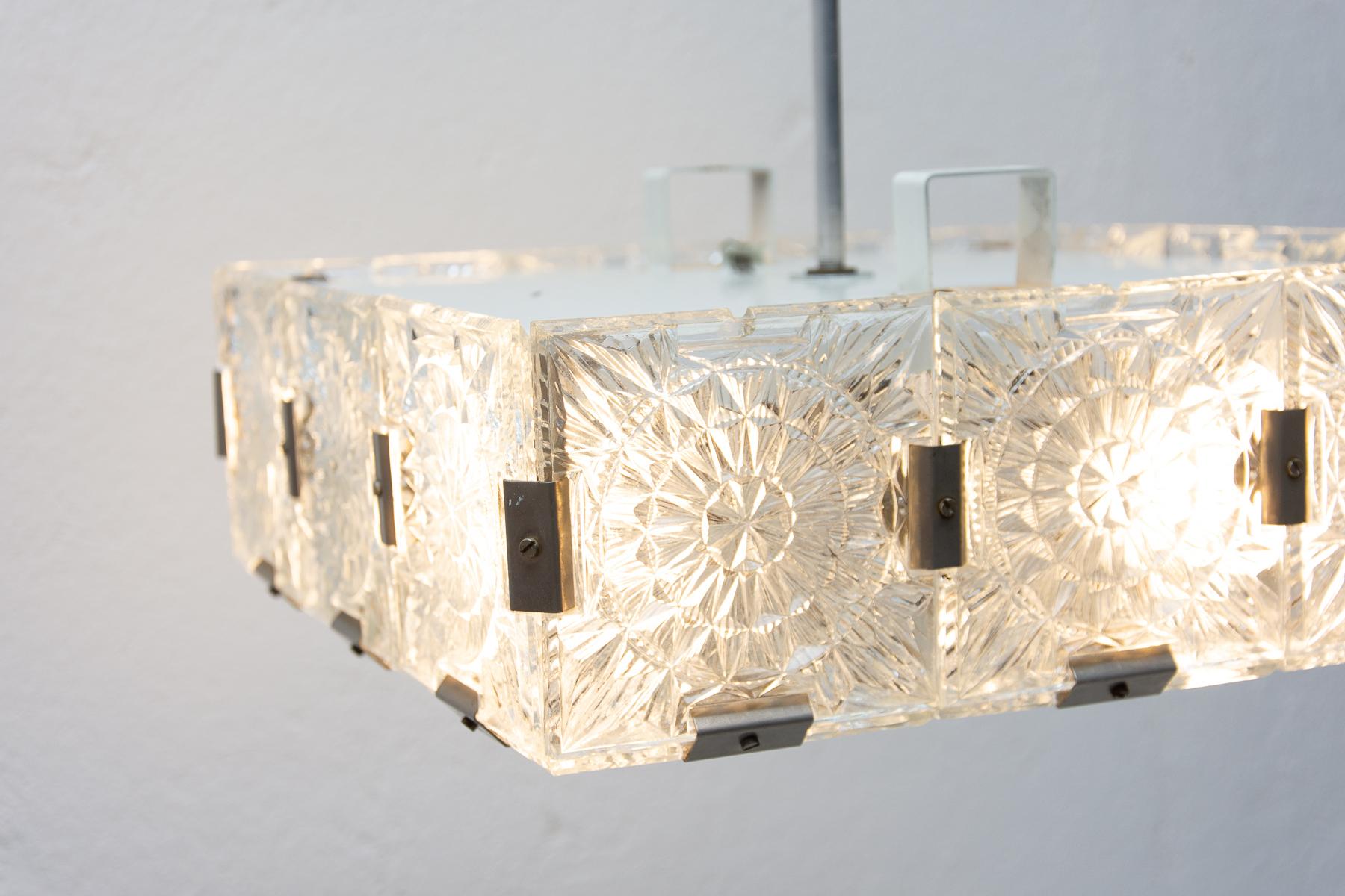 Glass and chromed steel pendant lamp, circa 1970, Czechoslovakia. It was produced by Kamenický Šenov. It is made of a combination of glass and metal. It was completely professionally cleaned and rewired.