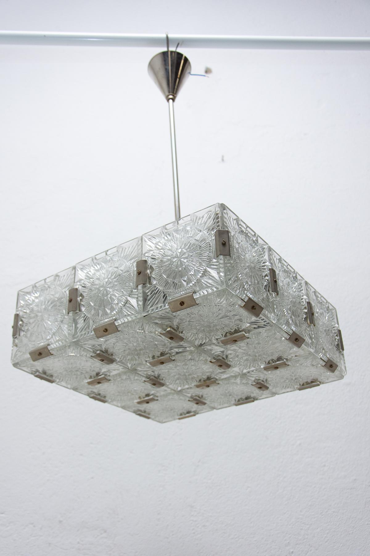 Glass and chromed steel pendant lamp, circa 1970, Czechoslovakia. It was produced by Kamenický Šenov. It is made of a combination of glass and metal. It was cleaned and rewired. E27 bulb socket. Up to 250 V

Measures: Total height: 65 cm

width: