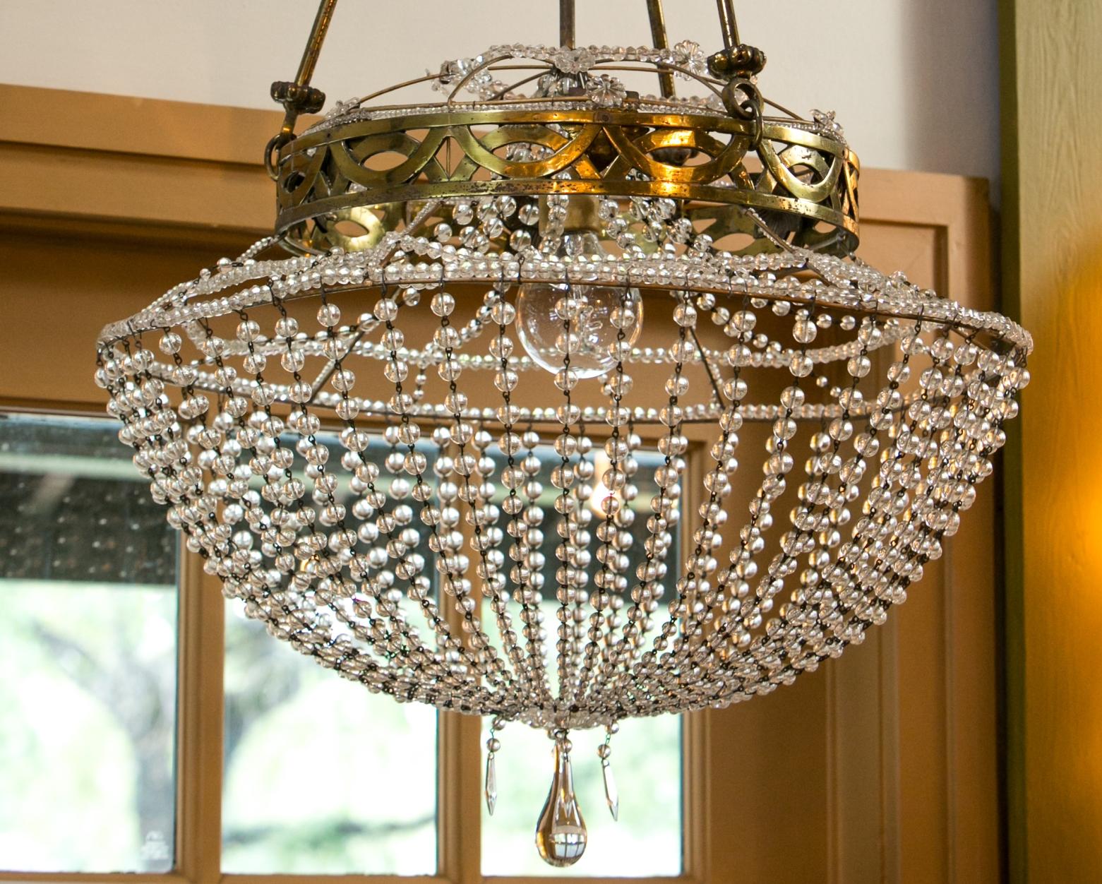 Vintage glass beaded basket chandelier from Austria. Glass beaded basket-form chandelier, with a gilt-brass frame, suspended by four decorative rods that meet above at a central gatherer. Newly wired for use within the USA. Includes extra chain and