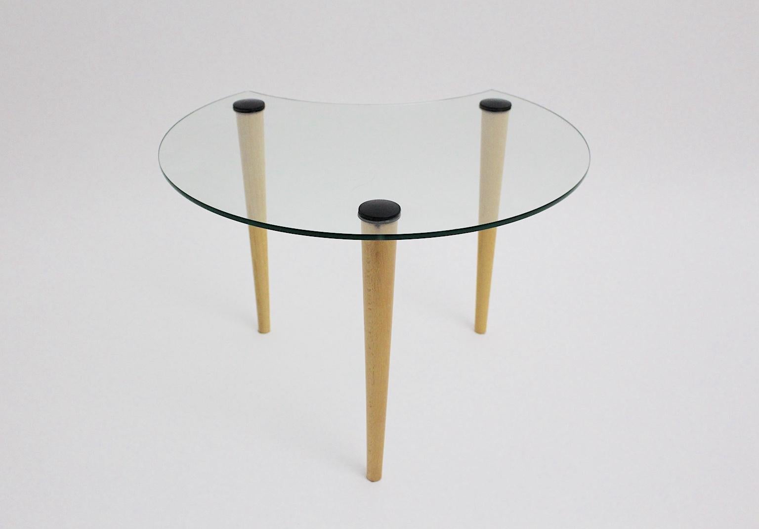 This vintage glass coffee table / side table shows a sickle-shaped glass top and three beech legs. The coffee table was designed and made in the 1970s in Italy.
The vintage condition is very good.
Approx. measures:
Diameter 60 cm
Height 42 cm.